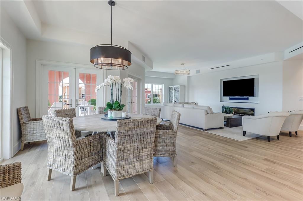 Experience an upscale turnkey residence unlike anything of its kind.  With captivating penthouse water and city views from three balconies, this 3 bedroom en suite condo has been completely transformed from its original floor plan and fully renovated to offer a modern coastal design for a true luxury setting. You’ll revel in the home’s bright, skylit openness, relax among the subtle and refined tan, brown, and white color palettes that remind you of lounging with your toes in the sand, and still live in high-tech opulence with a subzero fridge/freezer, wolf steam oven, 80-bottle wine cooler, double wall oven, Miele coffee maker, electric blinds, Toto toilets, Sonos media center, hurricane windows and doors, LED lighting, and Italian porcelain floors.  
You'll enjoy all of this at Bayfront - a primely situated community that offers a lifestyle of convenience, excitement, and relaxation.  An array of luxurious amenities are available on-site including 2 pools, 2 spas, a fitness center, grills, pickleball, tennis, and many outdoor spaces. Bayfront also is home to a selection of delicious restaurants, a unique waterfront Cabana bar, and an adventure shop offering boat rentals and outdoor excursions.  Located just minutes from the heart of Naples, you’ll have easy access to vibrant Fifth Avenue, the charming Third Street South area, and historic Tin City. Visit the iconic Naples Pier, relax on the sandy beaches of the Gulf of Mexico, or catch a performance at the new Gulfshore Playhouse. Enjoy tranquil moments at Baker Park and discover more unique shopping and dining experiences, all within a short distance.