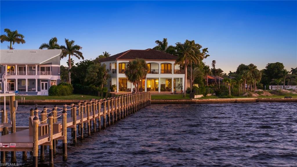 LUXURY RIVERFRONT LIVING. Custom Carlton-Naumann 6,394 Sq. ft. masterpiece, where a rare opportunity with unobstructed water views awaits you. Expansive pool and new 320-foot dock, Boat lift and space to fit multiple boats, perfectly positioned on an oversized .39 acre lot, directly on the CALOOSAHATCHEE RIVER. 6 Bedrooms, Den, Study and 6 Bathrooms & pool access. Furniture is negotiable. Living room couch, chairs, throw rug and dining room set are brand new. Every inch custom designed to showcase panoramic water views and sophisticated coastal elegance. Step inside to soaring ceilings and seamless indoor-outdoor living spaces that frame the stunning River backdrop. Open-concept great room flows effortlessly into a Quartz & Granite kitchen, featuring top-of-the-line appliances, custom cabinetry and a grand island ideal for entertaining. Underground propane tank services kitchen cooktop, Pool heat, outdoor kitchen and Fireplace. Equipped for whole house generator. Impact glass throughout. Retreat to a lavish suite, featuring a private terrace overlooking the river, spa-inspired bath and grand walk-in closet. Multiple guest suites offer privacy and comfort for family, friends and guests. Outside you will enjoy the ultimate Southwest Florida lifestyle with a resort-style pool, expansive covered lanai, outdoor kitchen and private dock, perfect for boating, fishing, water sports and sunset cruises. Located just minutes from fine dining, shopping and beaches, this gorgeous property blends tranquility with convenience. From sunrise to sunset and evenings by the pool, this is more than a Home. It is Paradise...on the RIVER.