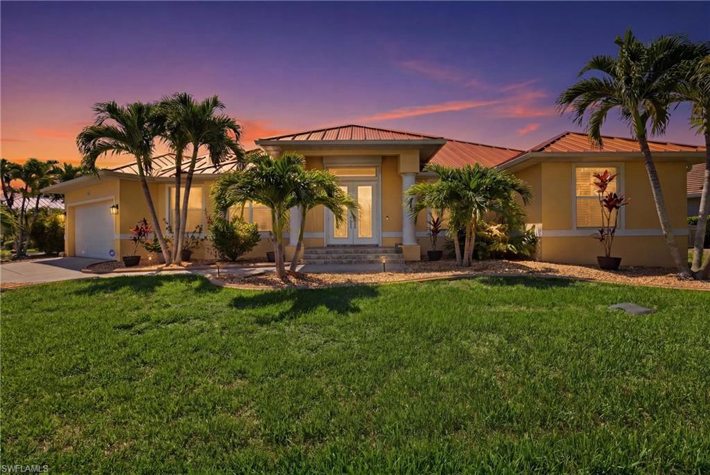 Waterfront living at its finest in Punta Gorda Isles! This DIRECT GULF ACCESS 3-bedroom plus den, 2-bath pool home sits on an oversized corner lot with stunning intersecting canal views and direct boating access. A paid off WHOLE-HOME SOLAR system provides exceptional energy efficiency while helping keep utility costs low. Outdoor living is exceptional with a covered lanai, oversized screened heated pool, fenced backyard, and picturesque canal views. Southeastern rear exposure fills the outdoor space with warm Florida sunshine throughout the day. Boaters will appreciate the private dock with 50-amp shore power and a 13,000-pound boat lift.  Inside, you'll find more than 2,500 square feet of thoughtfully designed living space featuring soaring ceilings, fresh interior paint, plantation shutters, tile flooring throughout, and an open great room with expansive pocketing sliding glass doors that seamlessly connect to the lanai. A split-bedroom floor plan provides privacy, while the primary suite features dual walk-in closets and a spa-inspired bath. Both the primary suite and one guest bedroom offer sliding door access to the lanai and pool. Worry free living and peace of mind upgrades include a newer roof, HVAC system, and electric pool heater, a Generac whole-house generator, owned 1,000-gallon underground propane tank, security system, & an epoxy-coated garage floor. Located in the highly sought-after Punta Gorda Isles boating community, you'll enjoy easy access to St. Andrews South Golf Club, Fishermen's Village, historic downtown Punta Gorda, waterfront dining, world-class fishing, and gulf beaches. This exceptional home offers the Florida lifestyle you've been dreaming of!