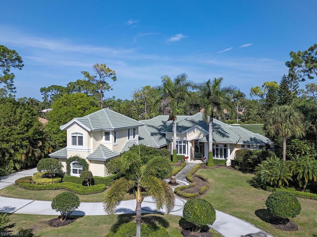 Welcome to Resort Style Living, Welcome to Grey Oaks! The Estates at Grey Oaks, where luxury meets tranquility. Beautifully manicured and located on the 7th fairway of the Pine Course. You will be captivated by this magnificent home the minute you pull into the large circular drive. Upon entering, the views are outstanding. Featuring a new kitchen, and four spacious bedrooms, all with en-suite bathrooms there is plenty of room for family and friends.  The new master bath overlooking private outdoor courtyard completes the master wing.  Step into a world of expansive outdoor living, complete with a captivating pool and spa, an outdoor kitchen, and outdoor fireplace. The interior of the residence features multiple living areas, and an abundance of natural light. New roof and meticulously maintained, where every detail has been carefully crafted to create a truly exceptional living experience. Grey Oaks Country Club is Naples one and only private club with 54 holes of golf. In addition, the club offers exclusive amenities for all, from the newly renovated wellness center to the lagoon style pool, tennis, pickle ball, bocce, restaurants, spa... the amenities are endless.