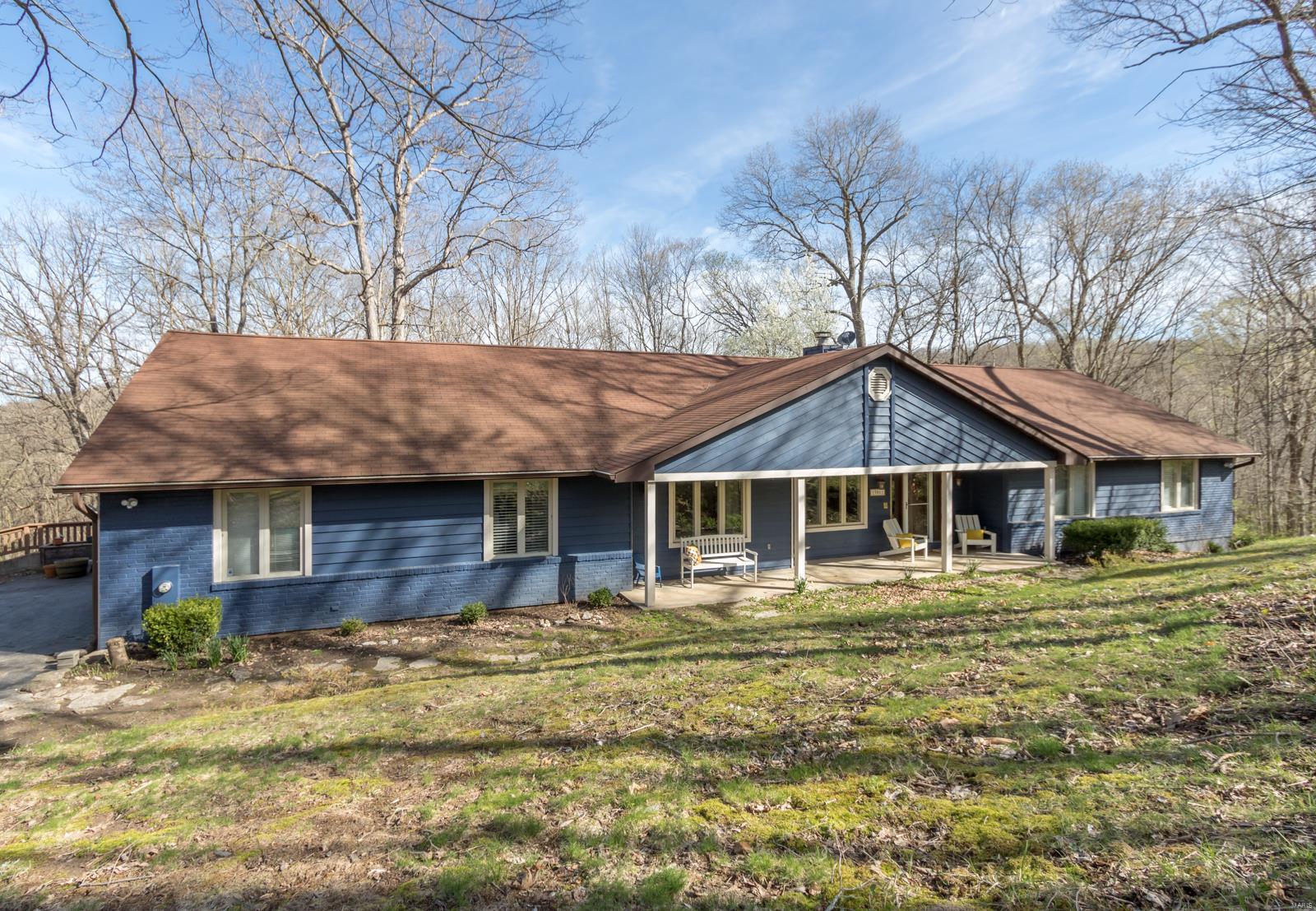 5bd/2.5bth updated ranch nestled on 3 private wooded acres in the Rockwood School District gives you over 3,000 sq ft of living space.  Great room with vaulted ceilings is the heart of the home with an open floor plan.  Hardwoods throughout the main living area including the light filled eat in kitchen.  The large master suite will make you feel as if you have stepped into a spa with the updated bathroom (2017) and walk in closet. We can’t forget our furry friends who have their own washing station off the updated mudroom and laundry room (2017). Large deck and stamped patio with pergola (2014) are ideal for taking in the park like beauty. This home is for the buyer that wants to feel like they are on vacation, but only a few minutes from Wildwood Town Center.  Wine cooler, solid surface counters, induction down draft cook top, walk-in pantry, central vac, 3 car garage, large deck, fence (2016), gutter guards (2016) are just some of the features of this home. Additional Rooms: Mud Room