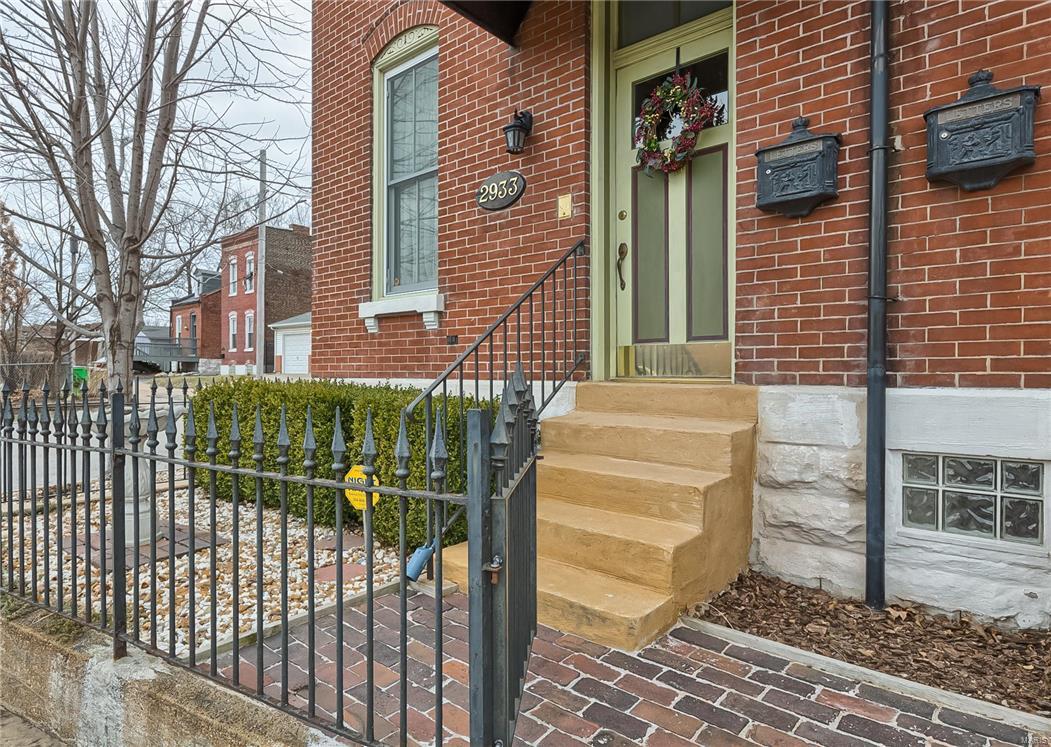 NEW PRICE! Fabulous townhouse in Benton Park with an unmatched view of the Anheuser Busch Brewery! The best of all worlds, updated yet historic living. Complete rehab in 2004, and improved and updated since. 3 Floors of luxury living include 10 ft ceilings, pocket doors, plantation shutters, a gas vent-less fireplace and recessed lighting. The kitchen was redone in 2014 with new cabinets, granite counters, subway tile back-splash and newer stainless appliances. There are beautiful hardwood floors, ceiling fans, recessed lighting, fresh paint. There is a full bath on both upper levels, one with a jet tub. New windows in 2014, new sidewalk and driveway in 2006. A huge private deck spans the space between the house and the garage, and is enclosed by a privacy fence and shrubbery. The over-sized 2 car garage has room for storage. Absolutely beautiful and so many features that you have to see it for yourself! Enjoy city life to the max-walking distance to so many restaurants and nightclubs.