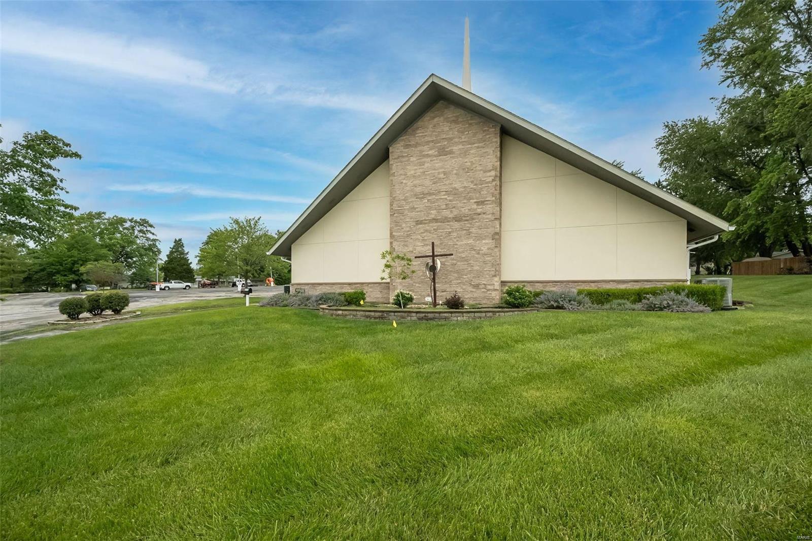 Prime location church building looking for it's next owner! This well maintained church building located right off Mexico and Mid Rivers is the perfect spot for a growing church or other business looking for space! Building sits on 2.37 acres with plenty of parking in the heart of St. Peter's. Main sanctuary seats up to 200 people and comes equipped with all the AV equipment needed! Building also boasts a large entry foyer, multiple classrooms, restrooms and offices on the main floor. The second floor is highlighted by a large gathering space, another restroom and mini kitchenette. This building has been well maintained over the years but seller prefers to sell it as-is. Seller is also willing to leave/sell all furniture and fixtures that remain there. Location: Suburban