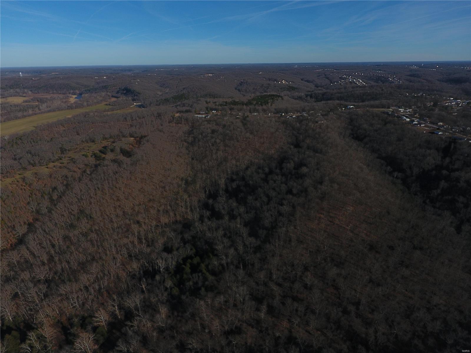Wooded 150 ac tract including 21 platted subdivision lots with opportunity for future development. City water, sewer, and electric available. Paved road access. Perfect recreation land for hunting, camping, or secluded home all close to town. Only 3 miles from Gasconade river access. Agent/Owner. Priced to sell! Only $800/acre!