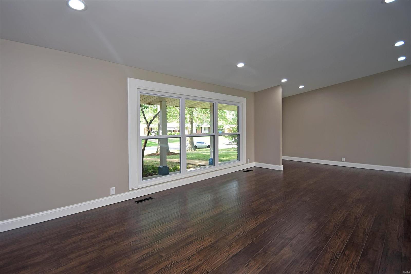 This is the home you have been looking for!! With updates galore, Award winning schools and prime location you can't miss out on this one!! This absolutely stunning FOUR bedroom two bath contains an almost whopping 2,000 square feet of modern living pleasure. The sleek NEW wood floors, soaring vaulted ceilings and massive windows give the space a bright cheery atmosphere. The NEW kitchen is the glamorous addition that is perfectly suited for WOWING family and friends.  All NEW stainless appliances, NEW CUSTOM cabinets, gorgeous NEW Counter tops, NEW sink, NEW faucets, NEW light fixtures,NEW tile back splash,NEW wine cooler.... And we haven't even touched the rest of the house. This once tired home has been lovingly rejuvenated and given new life. All the plumbing is NEW. All the  bathrooms are NEW. NEW hot water heater. ALL NEW electrical including the 200 amp Breaker box. This is your opportunity to have all the modern updates in one of Ballwins beautiful established neighborhoods.