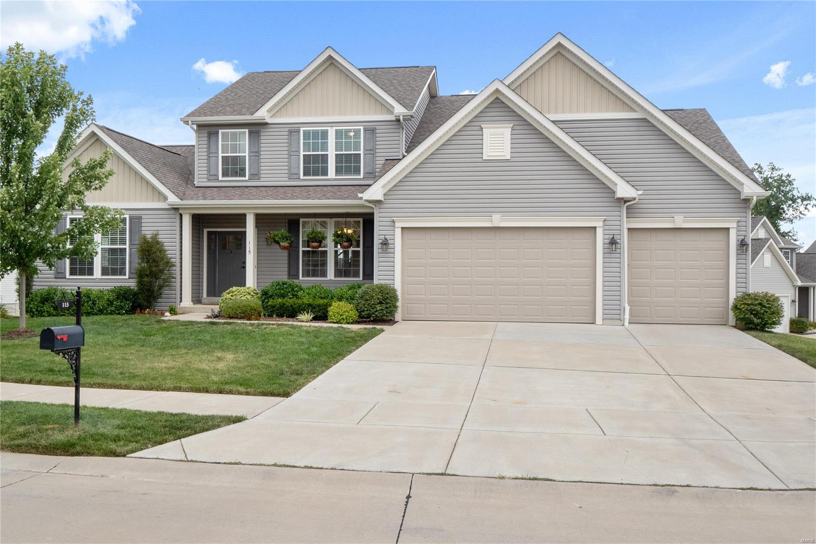 Gorgeous, less than 5 year old custom built 1.5 story in great area! Wall of windows across rear of home overlooks large walkout lot with wooded area beyond. Beautiful wood flooring and soft neutral colors throughout, 9' ceiling heights, hearth room with woodburning FP. And what a WOW kitchen! Tons of cabinets, walkin pantry, huge island, designed for multiple cooks or fabulous entertaining area! Main floor master suite with BIG closet and his and hers vanities, separate shower and tub. Upper level features loft/media area for the kids, two bedrooms sharing a jack and jill and 4th bedroom with private bath. All generously sized and big closets! Unfinished walkout basement with rough in for future use, dual HVAC. Main floor laundry with big window, 3 car garage, maintenance free deck with stairs, inground sprinklers system. Large cul de sac lot would be perfect for a pool! Move in ready!!!
