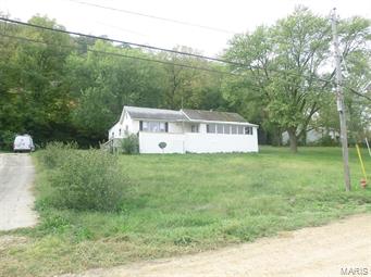 Overlooks Mississippi River but not flood plain; 2 bedrooms with possible third. 2 car attached garage. Keep an eye on barges, fishing boats and river traffic from the sunroom. Some assembly required. Seller will not complete any repairs to the subject property, either lender or buyer requested. The property is sold in AS IS condition. Pre-Approval letter or Proof of Funds required. Sale addendum and earnest money as certified funds will be required for final acceptance. SpecialListingConditions: Foreclosure
