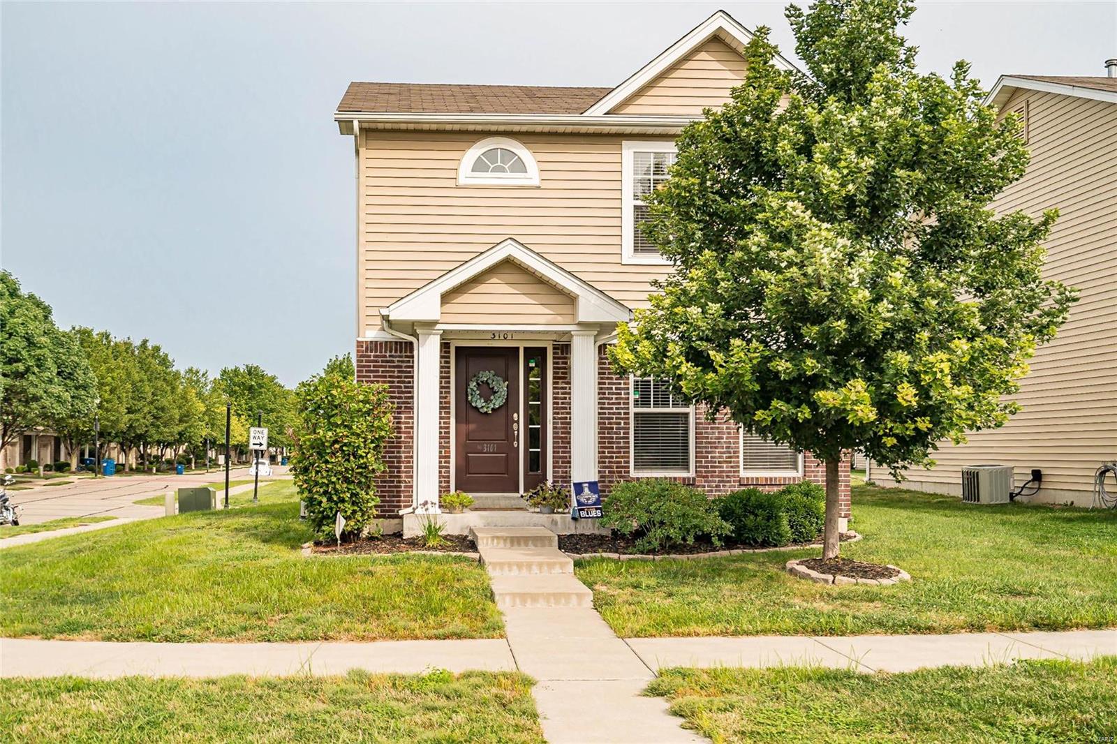 Beautiful 2 story stand alone town home with amazing curb appeal.  Covered porch.  Great corner lot.  Rear entry garage with opener.  Super spacious living room with upgraded laminate flooring and an opening to the kitchen/ breakfast area. Upgaded 42"espresso  cabinetry, stainless appliances and large double door pantry.  Sliding glass doors to the patio.  Nine foot ceilings on the main level.  Powder room with adult height vanity.  Upstairs enjoy the office/study nook.  Two spacious bedrooms and a full bath.  The master has a large walk in closet and a ceiling fan.  Lots of fresh paint.  Full basement with rough-in bath and an egress window.  Enjoy the wonderful life near bike paths and the Katy trail. Easy walking distance to New Town shops, restaurants and fun events.
