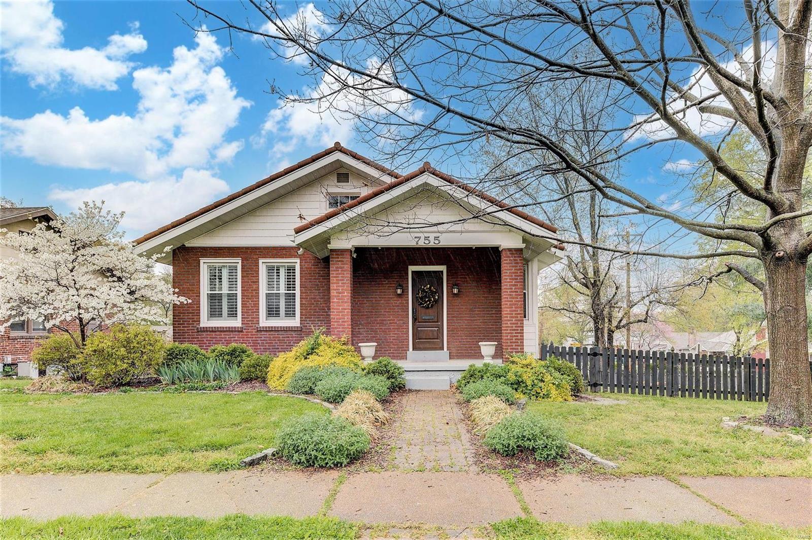 Here it is - the quintessential cozy cottage in old Webster! You will love the high ceilings, archways, deep millwork, shining hard wood  floors and handsome fireplace. And, luckily, the wonderful features of an older home are paired with a newer kitchen and bath. The bright, white kitchen comes complete with stainless steel appliances, quartz countertops, stylish glass backsplash, movable island, and tons of pantry space. The fun keeps on coming outside with your two level deck and spacious, fenced yard. Other notable features are replacement windows, plantation shutters throughout, great lower level storage, convenient tuck under garage and many updates. This one is the whole package - charm, location, and affordability!! Don't miss it!