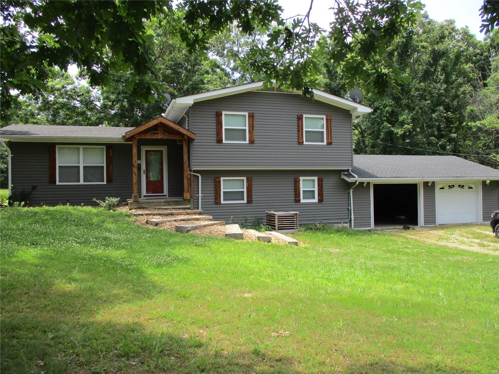 Make an appointment today to see this 4 bedroom, 2.5 bath home sitting on 2.3 acres. There is a 2 car attached garage with work area, a covered patio in back, a large deck overlooking your fenced in yard. Home has had a lot of updates such as new siding, roof, drainage has been updated around house to keep any water away from house. bathrooms have been remodeled. Home has a huge family room on lower level. Call for an appointment today