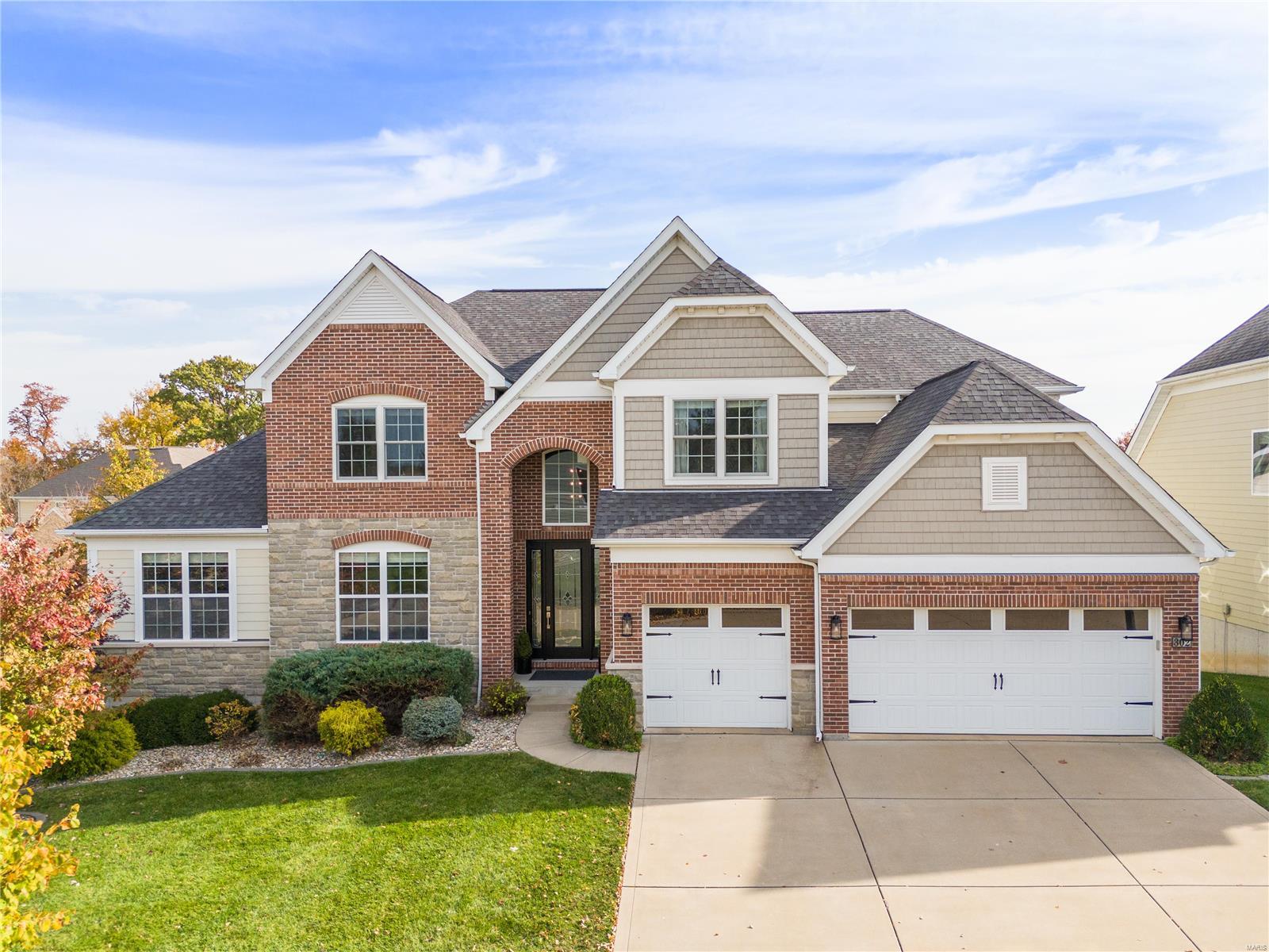 Located in the heart of Chesterfield, this 5-bed, 4.5-bath, 1.5-story home blends comfort & style in a desirable neighborhood. Upon entry, a spacious foyer with hardwood floors leads to a formal dining room & inviting family room with a stone-accented fireplace, vaulted ceilings, & large windows that fill the space with natural light. The gourmet kitchen features granite countertops, stainless steel appliances, and ample cabinet space. Enjoy casual meals at the breakfast bar or in the eat-in area, with easy flow to the living spaces. The main-floor master suite boasts a tray ceiling, walk-in closet, and a spa-like bath with a soaking tub, separate shower, and double vanities. Upstairs, three bedrooms, a rec area, and a loft offer additional space. The walkout lower level has an in-law suite with a living room, kitchen, bedroom, bath & laundry. Outside, enjoy a large deck, patio, & private, landscaped yard. This home offers both luxury and functionality, perfect for Chesterfield living.