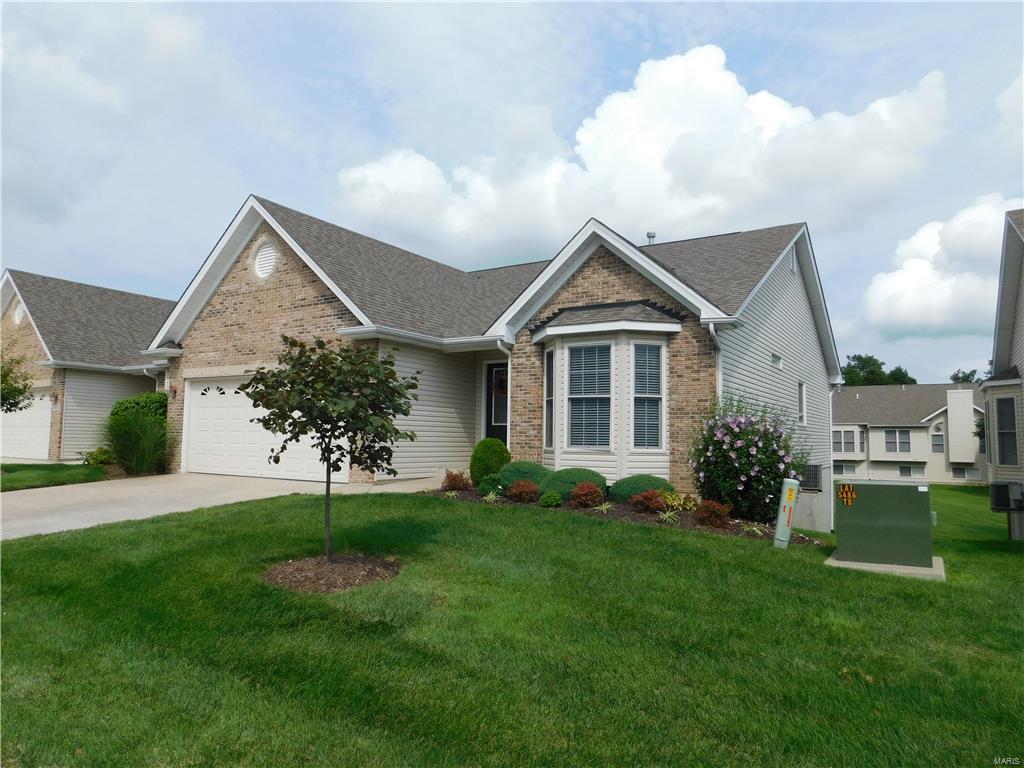 This attached ranch Villa is one you don't want to miss. The home features an impressive open floor plan which includes vaulted ceilings through the living room, dining room, breakfast room, and kitchen. The kitchen also includes a peninsula sink arrangement with new counter top, breakfast bar, 42" cabinets with decorative crown molding, ceramic tile floor, and pantry. The ceramic tile flooring is located in the kitchen, breakfast room and laundry room.The Master Suite features a Bay window, ceiling fan, walk-in closet, full size master bathroom room with double sink, separate shower and whirlpool tub. The second bedroom has a ceiling fan and bay window. The home also includes a walk out in lower level, covered deck, patio, rough-in for bath, 2 car garage with insulated door, garage door opener, upgraded front entry door, and gas fireplace with mantel. The interior has been freshly painted, new dishwasher, lighting and kitchen counter top. Location: End Unit, Suburban