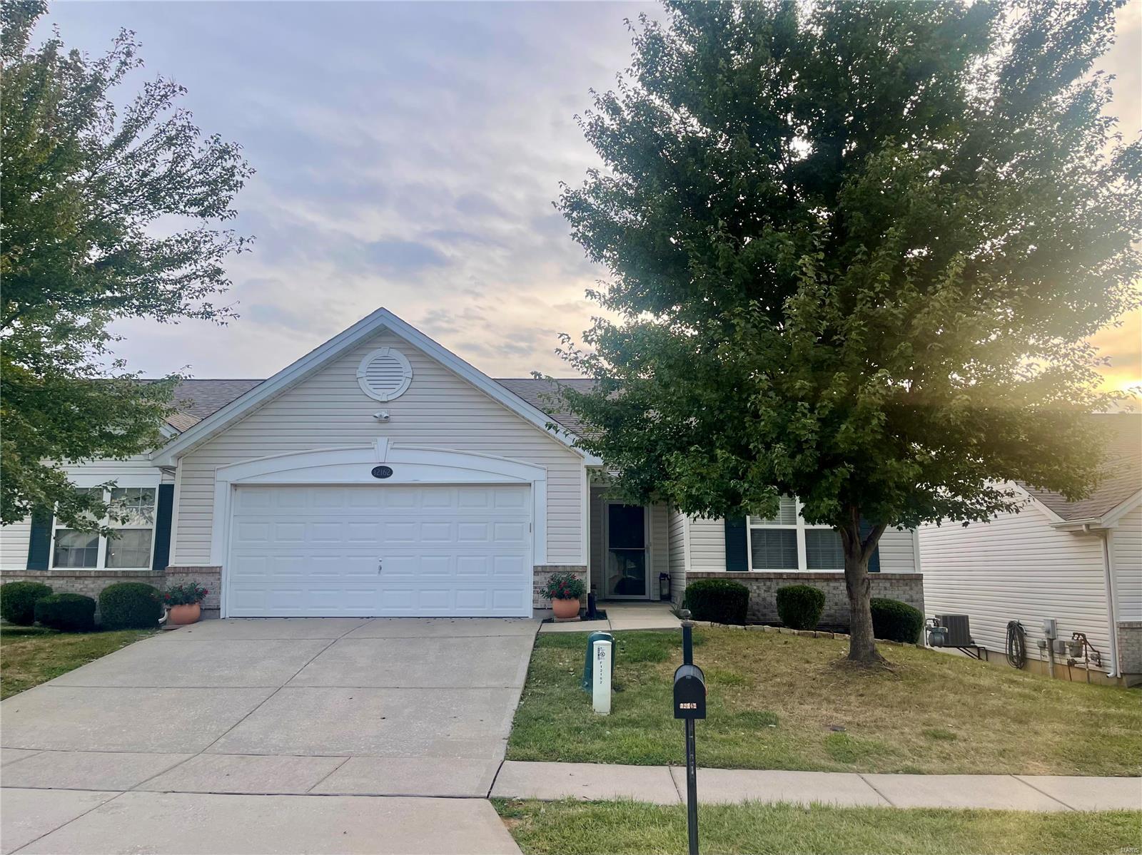 This is the Villa you've been waiting for!  Now is your chance to own this meticulously cared for, updated villa in the quiet subdivision of Mckelvey Place!  As you walk in you will fall in love with the vaulted ceilings and the open floor plan with beautiful wood floors and large windows.  The kitchen has custom 42 inch cherry cabinets with eat in dining with a deck overlooking the retreat of beautiful trees and yard.  The master suite has a large walk in closet and bathroom with shower.  Main floor laundry and attached 2 car garage make this villa easy to get around!  Take the stairlift down to the massive walk out lower level that has 9 foot ceilings with an egress window ready to be finished and a full bath.  Updated hvac systems/hot water heater….this villa has it all and is ready for its new owner! Close to shopping, highways, parks, schools.