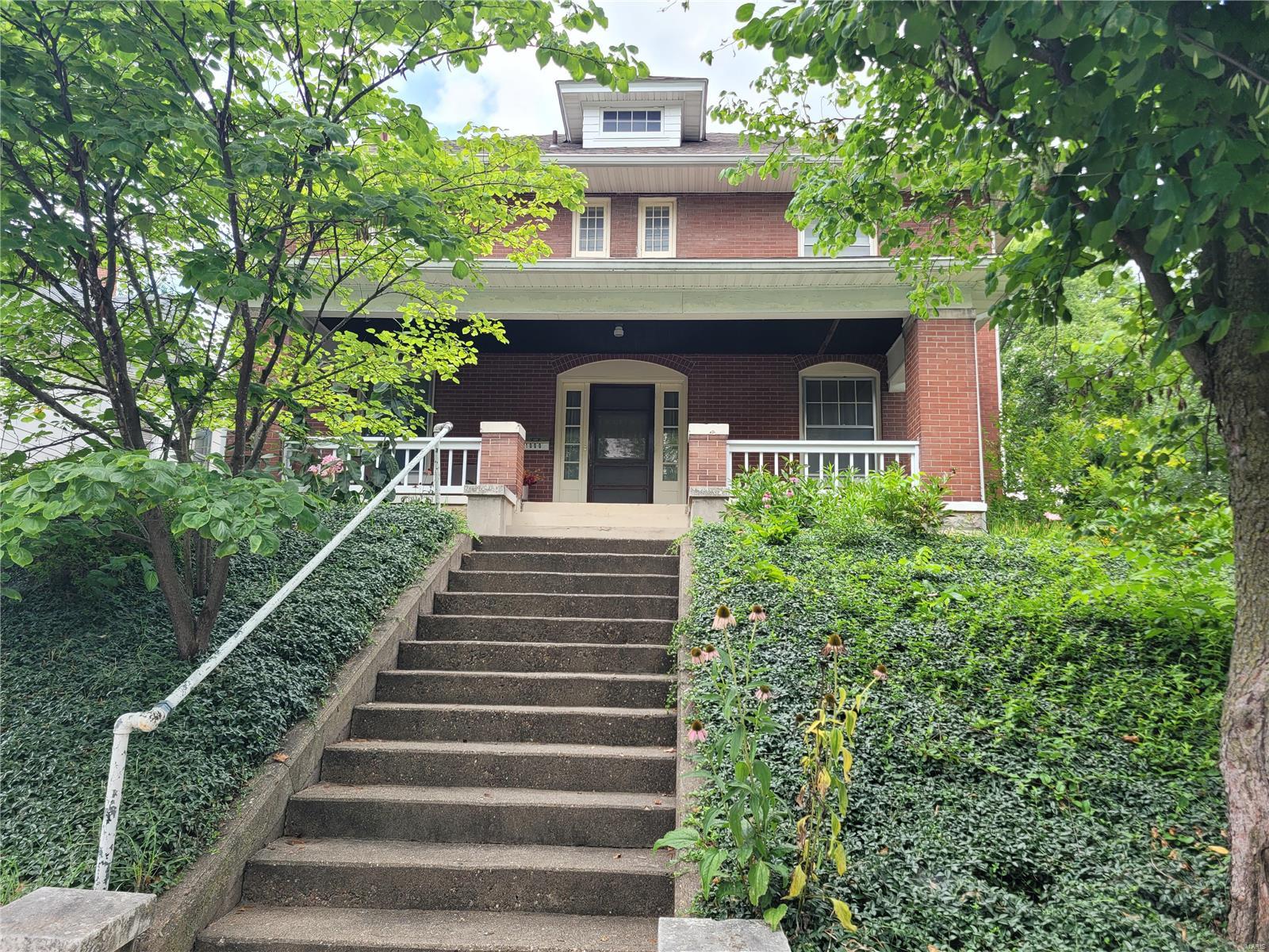 Spacious, full brick home in the Maple Street Historical District was built in 1910. Its design is influenced by the Prairie style with the roofs of the porch, house, and dormers all have very wide, enclosed eaves. The facade has very clean lines, with massive square, brick corner posts supporting the porch.  Located behind Rockcliffe Mansion.  This home has original hardwood floors, crown moldings, formal dining room with many windows and lots of space for family gatherings and entertaining, Butler's pantry,and built-in linen storage View of the yard and wooded lot offers a relaxing atmosphere. Half bath conveniently located under the front staircase. Stained glass windows on staircase, leaded glass windows in the living room. Updated kitchen sensitive to the style with oak Craftsman cabinets. Newer range and refrigerator will stay. Five spacious bedrooms with large closets grace the 2nd floor. 2 full baths one being a Jack and Jill. Full floored attic. Newer HVAC and roof (2012)