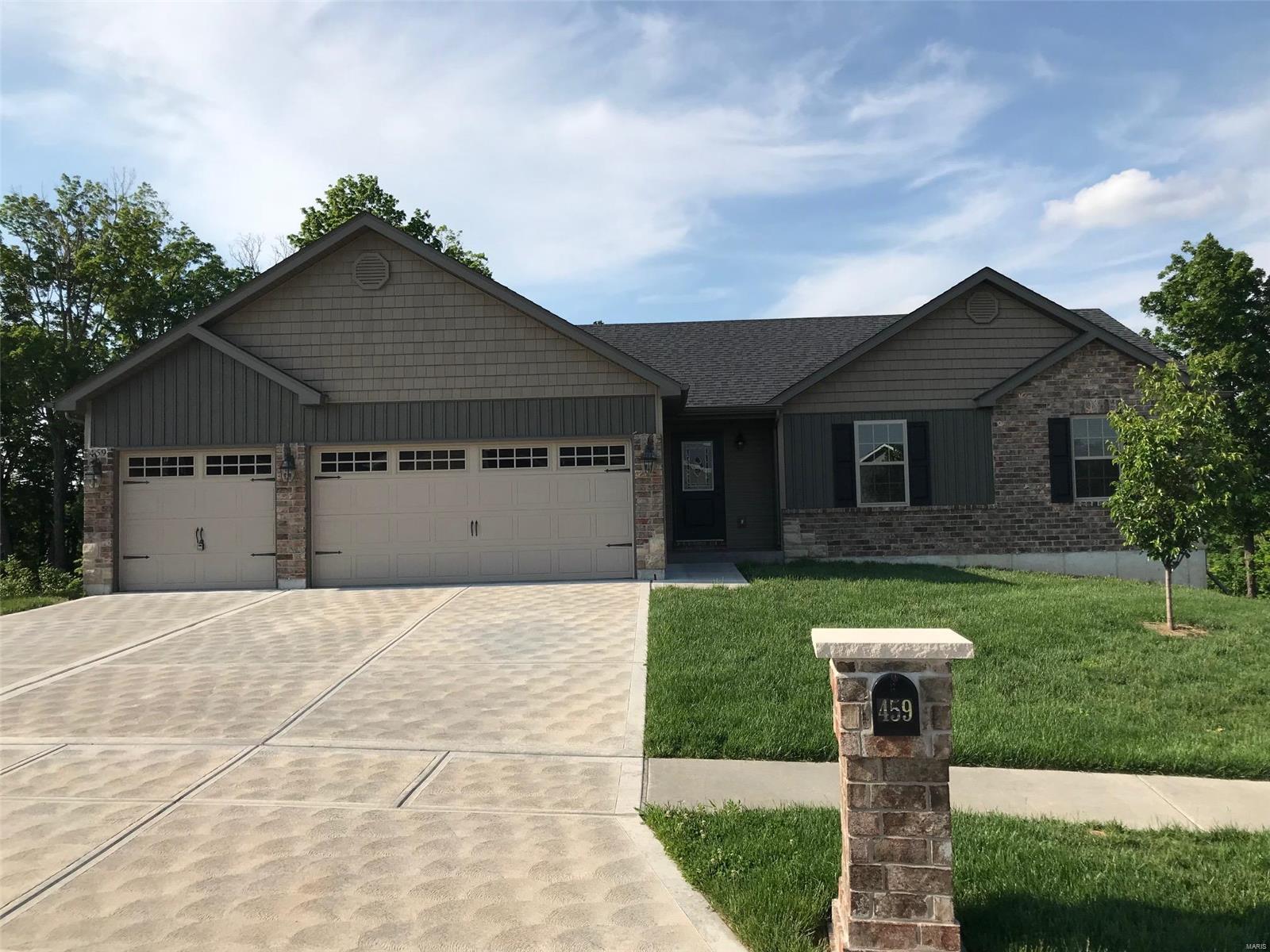 This 2 year NEW home has every upgrade you could imagine! (3 BED/2 BATH). They include 3 CAR Garage, vaulted ceilings, rounded corners, granite countertops, stainless steel appliances, MAIN floor laundry, maple cabinets with "soft close", ceramic tile (in kitchen, laundry, baths), center island, brand new carpet, custom neutral colored paint job throughout, framed windows, taller baseboards, adult sized cabinets in bathrooms with marble countertops, walk-in closets, upgraded carriage doors on an oversized 3-car garage, garage door openers, brick mailboxes, 6 panel doors, and upgraded water/light fixtures throughout the house!