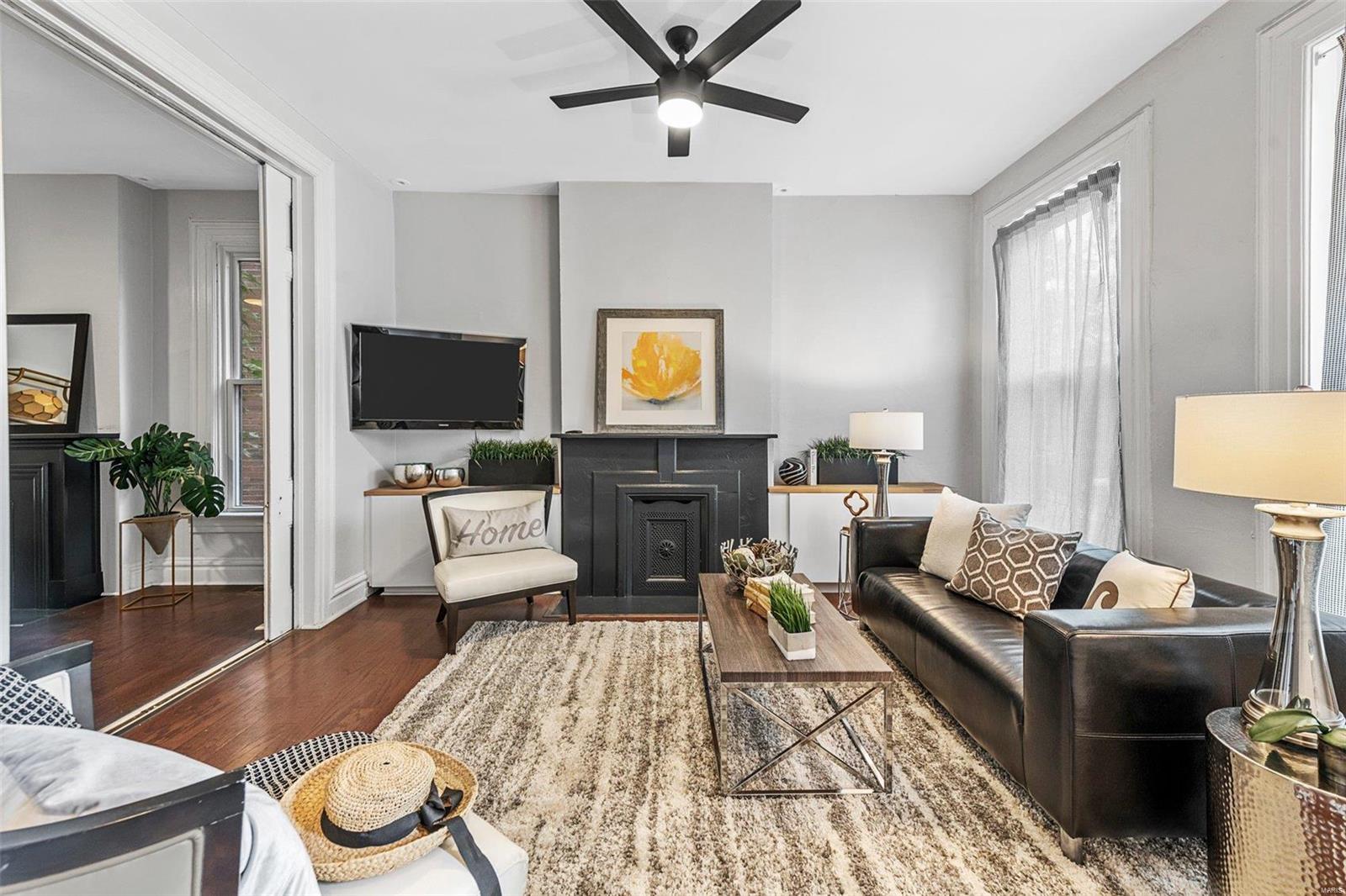 Located in historic Compton Hill Reservoir Park neighborhood with park/walking trails, play ground, tennis courts and dog park just steps away! Step inside this elegant 3 bedroom, 2 bath single family home & be swept away by the details of this beauty.  The living room is spacious with tons of natural light, opened up to the dining room for open floor plan- both have old world feel with pocket doors & ornate fireplaces. Enjoy your morning coffee at the breakfast bar with exposed brick breakfast nook. The kitchen features stainless steel appliances, butcher block countertops with open shelving. Beautifully updated full bath on main floor. Upstairs has 3 large bedrooms all featuring high ceilings & natural light. The master bedroom has hardwood floors & an ornate fireplace adding historic charm. Completing the upper level is another full bath & laundry. Located off the kitchen is your private brick lined courtyard with a privacy fence creating a perfect space to entertain.
