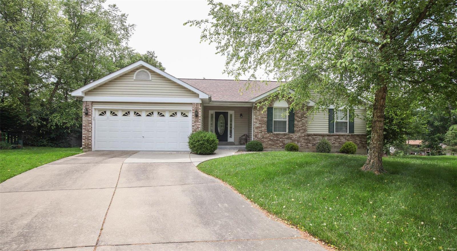 Well maintained, 3bed, 2ba ranch with 2 car garage and covered front porch. Large entry foyer with closet opens up to the spacious living room with vaulted ceilings, recessed lighting, ceiling fan and woodburning fireplace. Open floor plan makes entertaining easy with the eat in kitchen with bay windows and access to the deck. Center island, pantry, built in microwave, electric stove and main floor laundry off the kitchen. Down the hall you will find 2 guest bedrooms, a guest bathroom and the master suite. Double doors lead into the master suite with vaulted ceilings. 2 large windows to let in plenty of natural light. Master bath features corner tub, separate walk in shower and walk in closet. Unfinished walk out lower level has the potential for additional living space.
