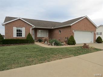 Brick ranch property has 4 bedrooms and 3 full bathrooms total. Home has beautiful open main room that encompasses living, dining, and kitchen space. Great room is partially carpeted and has a large fireplace set in stone. Kitchen area has custom flooring and stainless steel appliances. Kitchen island/bar area adds plenty of counter space for cooking prep, and storage underneath add even more space to go along with the pantry sized cabinets. Main level also has three bedrooms, two baths, laundry, and garage entrance. Lower level is mostly finished with a bedroom, full bath, and a large rec room that walks out to the backyard patio and decks. Lower level also has unfinished space for storage, mechanicals, and is windowless for possible storm shelter. Back yard is tiered and landscaped. Circle drive in front. SpecialListingConditions: Foreclosure