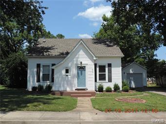 What a jewel! 1.5 story home nestled on a nice level lot near the heart of Farmington! Home offers over 1,700 sq.ft with old world charm & architectural detail with original hardwood flooring, bay windows, arched doorways, crown molding & trim, built in storage, upgraded vanities, lighting & more! Home offers a nice cozy living room & family room. Large, recently updated kitchen with lots of cabinet space, formal dining area, main floor laundry, 3 bedrooms with ample closet/storage space including the master suite with large tiled shower & TWO designated closet spaces! This home also comes with a basement perfect for storage or storm shelter. There's plenty of room for the family & pets to roam and play in the nice level fenced in back yard, & room for that garden you always wanted?! Don't forget to put all of your lawn and garden tools away in the HUGE garden/utility shed. Wait there's more!...nice back deck & there is also a 1 car attached garage! Call NOW to see your next home! SpecialListingConditions: Foreclosure