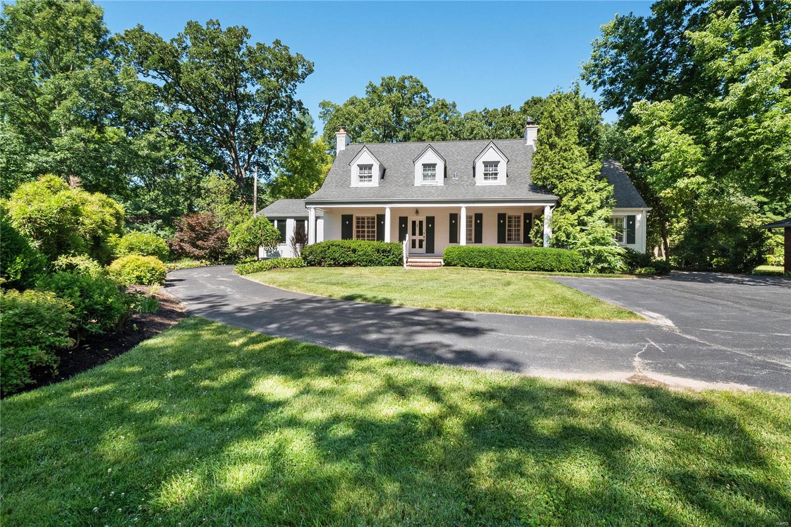 Property to be sold in "AS IS" condition.  Please use Special Sale Contract. Current owner has never occupied the home. Charming Cape Cod home in Ladue School District. Situated on 1.2 acres of beautiful park-like grounds, this property offers over 4200+sqft of living space. Upon entry you will find a 2-story foyer & grand staircase leading to upper level. Lovely formal living room w gas fireplace adjoins to both the light filled, glassed-in sun room & separate formal dining w French doors. All white, eat-in kitchen hosts double wall ovens & plenty of counter space & opens to hearth/family room w fireplace.  Beyond lies the quaint brick patio & rear yard access. Spacious main floor master w tray ceiling completes 1st level. Upstairs hosts 4 add'l bedrooms w 2 full baths & spacious landing. Add'l amenities include hardwood floors, main floor laundry, 3car garage, irrigation system & whole house generator.  Rear landscape includes custom greenhouse, manicured gardens & walkways. Additional Rooms: Sun Room