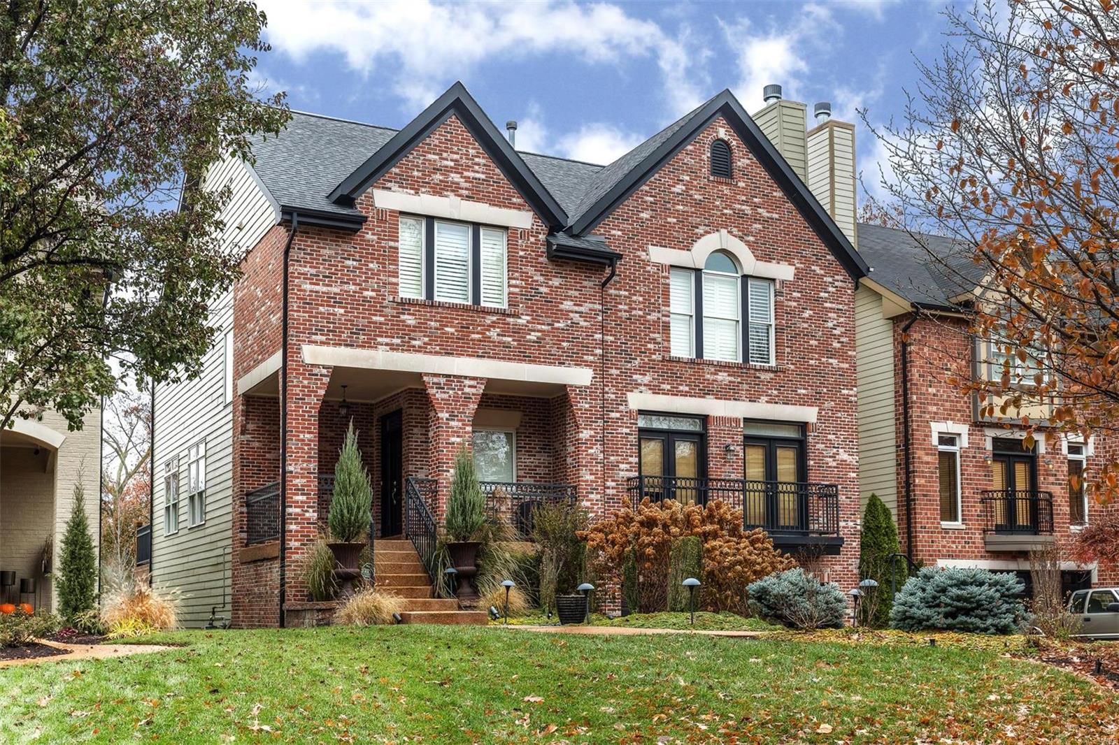 Conveniently located within walking distance to downtown Clayton, Wash U. and Forest Park.  This classic home features elegant millwork, hardwood flooring and modern amenities. The gracious foyer opens to a luxurious living room with gas fireplace, French doors span the room and open to the front balcony. The bright formal dining room with bay window and service door to the kitchen is perfectly placed. An open plan kitchen/hearth room is the heart of the home and is accessible to a wonderfully large deck.  Premium stainless appliances, walk-in pantry and breakfast bar make entertaining a breeze.  Upstairs find a spacious master suite with two walk-in closets and ensuite bath with walk-in shower, jacuzzi, and two vanities. Also, three additional bedrooms with ensuite bath access and upper level laundry. In the walkout lower level enjoy a large living space with wet bar and patio access, temperature controlled wine room, additional bedroom and full bath and two car garage.