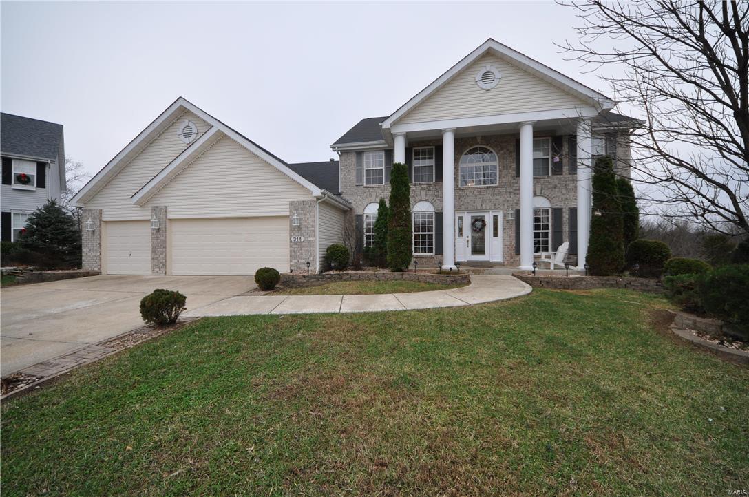 Sophisticated and charming, this family friendly 1.5 Story Atrium is truly a RARE FIND at this price! From the Beautiful Brick Front with plush landscaping, to the GORGEOUS Model Home quality interior, to the Stunningly Private back yard..this one has it all! Perfect for entertaining, the professionally finished lower level is EXCEPTIONAL and adds an approximate 950 sq. ft. of living space for a total of over 4,100 sq. ft! In addition to the many outstanding features of this home such as the spacious Main Floor Master, 2 Story Great Room and upstairs loft, you will also find many fun surprises such as a tuck away desk/work space alcove and a garage door at the rear of the home for easy access to store your yard tools and pool toys! The view out the back, whether enjoyed from the HUGE deck or inside from the large expanse of windows is SPECTACULAR year round! Located on a premium cul de sac lot, within walking distance to subdivision pools, ponds and soccer fields, this one is it!