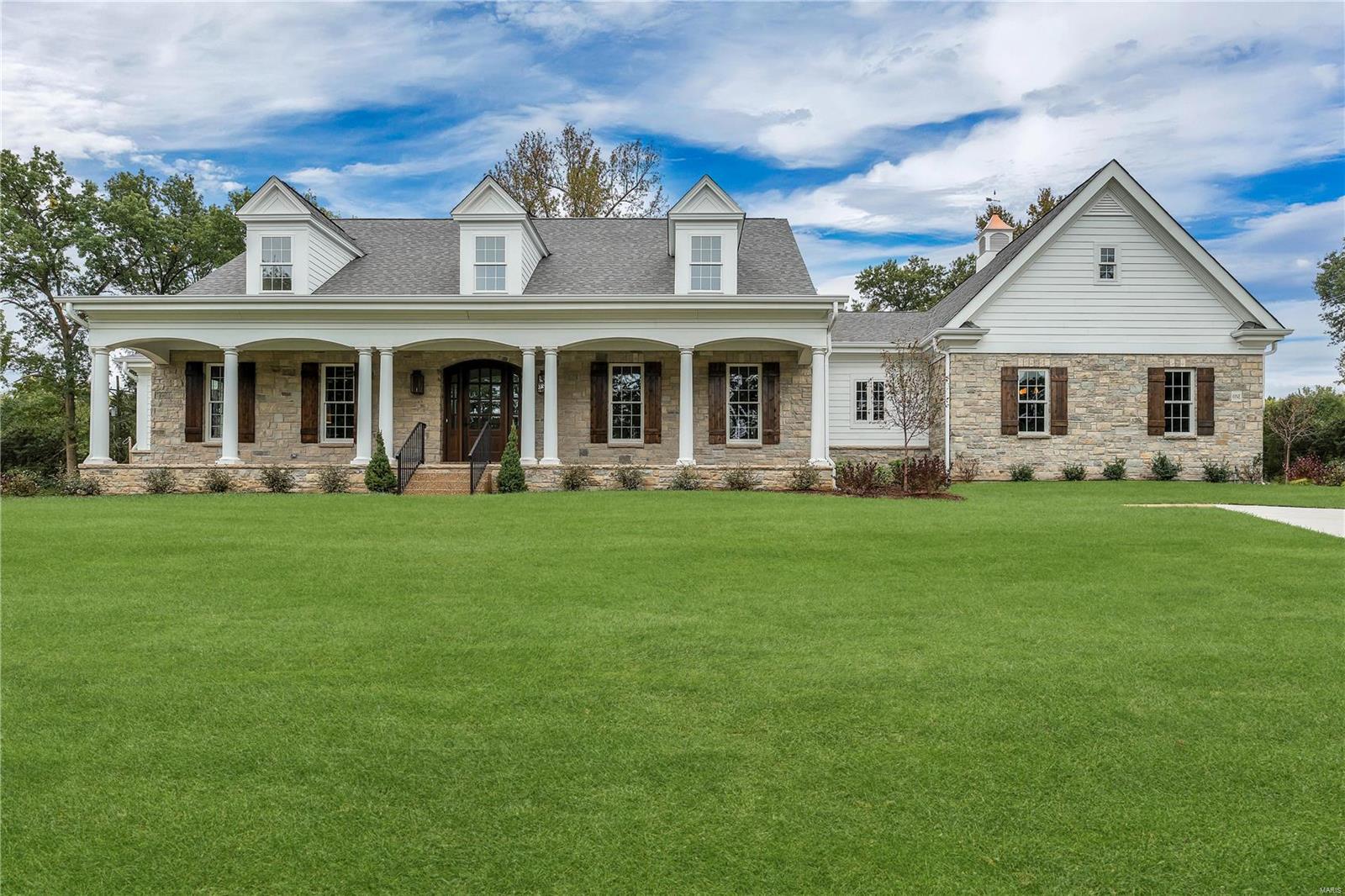 NEW CUSTOM HOME JUST COMPLETED BY KEMP SIGNATURE HOMES. Authentic features incorporated into exterior design incl. the classic front loggia w/copper gas lanterns, natural stone & cupola. Mahogany front door.  Entry foyer flanked by a traditional dining rm & study w/ full wall paneling. The kitchen opens to breakfast & hearth rm w/ painted box beam ceiling & see thru fireplace. Covered outdoor living room. Kitchen has 42" fridge, gas range top & dbl ovens, 2 dishwashers. Walk-in pantry. 2 POWDER ROOMS. ALL KOHLER PLUMBING. Mud rm w/ bench+cubbies+large laundry. Main fl 10' ceiling & 8' doors. Extensive millwork throughout. Huge master suite, spacious closets & a master bath w/ freestanding tub & huge shower w/ multiple heads. 2nd fl has 4 BEDROOMS all connected to baths. 4 CAR GARAGE. 1 ac. lot w/ pro landscaping & heavy treed berm.  Great lot for pool. Centricity Classic New Home 2/10 Warranty! Additional Rooms: Mud Room