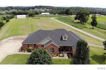 LOCATION!! LOCATION!! LOCATION!!! If the location of this gorgeous one-owner custom built brick home does not sell you, the spaciousness and beauty of the home will!! Only 10 minutes from Jackson or Cape, local hospitals and in Jackson School District  (less than two miles from Notre Dame H.S.). This lovely home boasts over 3,000 sq. ft. on the main level with open concept and vaulted ceiling, gas fireplace, custom cabinetry, dining room and cozy sun room, split bedroom plan with 4 bedrooms (master ensuite), 2.5 baths and laundry room. Brand new deck overlooks lovely three acres! Lower level includes additional full bath and 2 finished rooms that could be 5th & 6th bedroom, exercise room, media room or office. The 21'x47' family room is ready for floor covering of your choice and includes sink and cabinetry for wet bar. John Deere room includes 1/2 bath for convenience. Additional bonus is the 30x45 detached shop w/overhead door for man cave or hobbies. Ask for your private tour today! Additional Rooms: Sun Room