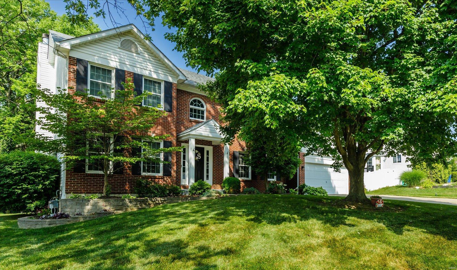 Location, location! Just 1/4 mile from 364 Bridge. Full brick front 2sty, 5 bed, 3 full, plus half bath. 2sty entry, split staircase, newer hardwood floors. Ceramic floors in kit/breakfast & mud-laundry room. Large fam room w bay, brick wood burn FP, built-in bookcases. Stunning cherry cabinets to ceiling with crown molding, granite counters, pull-out shelves, lazy susan, under cab lighting, plus desk w/cabinets. Master w vault ceiling, large closet, remodeled luxury bath. All new carpet installed on 2nd level. Finished LL with huge family room and game area. Bedroom w Egress safe window, full bath, kitchenette built-in bookcases plus plenty of storage with built-in shelves. O/S 2 car garage. Plus some newer paint. Hurry B4 the sign says SOLD!