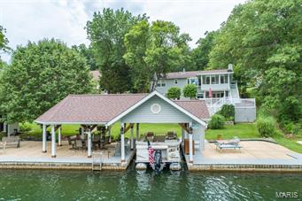 Waterfront property at Raintree Plantation, this beautiful home has 4 bedrooms and 3 bath. The Living room has gorgeous hardwood flooring, gas fireplace and natural lighting through out the home. The Formal dining room has crown molding with an adjoining sunroom with pergo flooring. The bedroom is a perfect place for morning coffee looking out at the lake. The kitchen has a breakfast bar, stainless steel double oven and loads of cabinets and counter space. Bathrooms have been updated. Relax in the Master bedroom with private bath and shower. The finished lower level has a rec room with a fireplace, a wet bar and bedroom and a full bath. It offers a walkout to a 2 tiered composite deck and beautiful view of the lake. This home has an added feature with a boat dock with a kitchenette area. A family dream home for sure!!! Additional Rooms: Sun Room