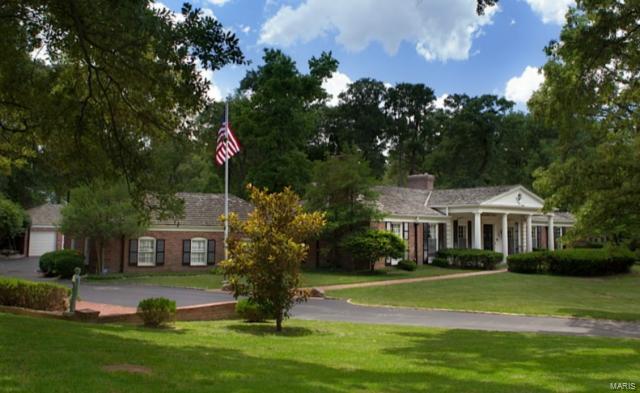 Noted as one of Ladue's signature homes, this magnificent ranch is situated on 3+ acres on a private lane. The Ladue Bridle Trail borders this wooded & nature filled neighborhood that is a tucked away gem worth exploring. Famed home builder, Hank Altepeter, built this home for his family in his signature county club style. The 34'x28' handsomely paneled family room, captivates family and guests with its soaring ceiling, sunken bar, & adjoining billiard room. The signature ceiling to floor walls of glass access the romantic Edith Mason patio garden with a tranquil cherub fountain; the perfect setting for the tennis court and saltwater swimming pool. The master suite accesses a covered porch, while the spa like bath accesses the pool. There are 3 more bedrooms on the main floor with updated baths. The walk out lower level has a private guest room, second family room, rec room, & visitor bath/changing area, that accesses the pool as well. The 5 car garage is an auto enthusiast delight. Additional Rooms: Mud Room