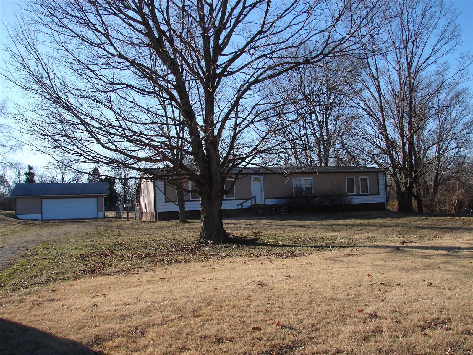 Lots of space for the money! Lot is amazing, level and serene! The house is just waiting for your personal touches or move right in! Home offers 2 living rooms, dry bar, divided bedroom floor plan, open kitchen and living room, master suite with large bathroom and walk in closet. All this in Jefferson R-7 school district. Call today for your showing.