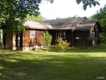 SECLUDED, NATURAL SETTING WITH LAKE ACCESS in picturesque valley near CONSERVATION LAND for hiking, boating, swimming, fishing, parks, & enjoyment! Spacious SUN-FILLED rooms, OPEN FLOOR PLAN ranch-style hide-away, with partial BASEMENT, only 15 years young!  Modern, TOTAL ELECTRIC home with vaulted ceilings, wood burning FIREPLACE, huge WRAP SUN DECK & large screened, covered porch. Comes complete with FURNITURE & APPLIANCES! Outside brick BBQ pit, picnic area, storage building, on 11 LOTS on both sides & rear (corner lot) PLUS a LAKEFRONT lot with DOCK. Water well & public sewer. PRIVATE LAKE DEVELOPMENT.