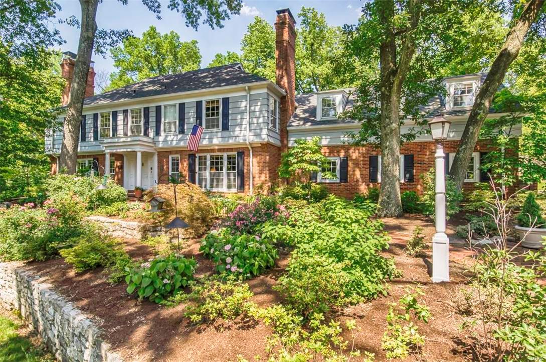 A touch of New England in the heart of Ladue. This gracious colonial home is set on more than an acre of beautifully landscaped grounds. Centrally located 6 bedroom, 4.5 bath home with over 5600+ sq ft of living space offers comfort while honoring tradition. Generous-sized living room and dining room with basket weave hardwood floors, built-ins and woodburning fireplace. The remodeled eat-in kitchen includes a large center island, granite countertops, high-end appliances & dumbwaiter to all floors. Family room with wood-burning fireplace and wetbar. Large master bedroom suite with, WBFPL, 4 closets, and master bath with double vanity. 5 large secondary bedrooms and 3 baths are found on the 2nd floor. Back staircase gives privacy to out-of-town guests. An additional room on the 2nd floor currently used as an office can easily be converted to large 2nd floor laundry room. Lower level with full kitchen for entertaining. Pool. Patio & screened porch. 3 car garage. Walk to MICDS.