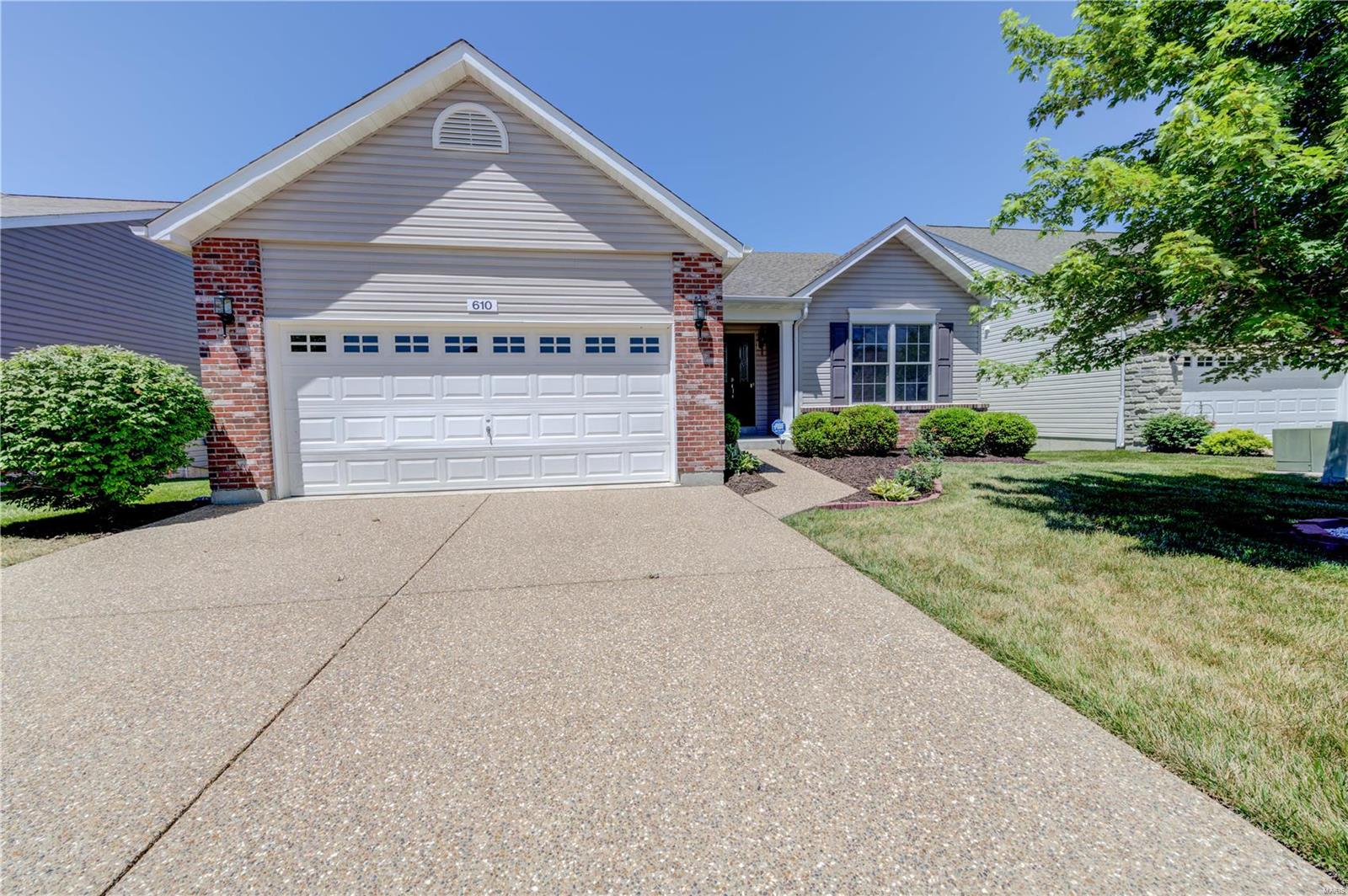 STUNNING updated ranch in Heritage at Hawk Ridge 55+ active lifestyle community in Lake St. Louis! Amenities include golf course, clubhouse, workout room, bocce courts, tennis/pickleball courts & activities! Open ranch w/ 1,676 sq ft, 2 beds, 2 full baths & main floor laundry & ramp in garage. NEW vinyl plank flooring & professional paint. Great Rm features vaulted ceilings with wall of windows overlooking a water view w/ fountain. Chef's Kitchen includes 42" cabinets, NEW Frigidaire SS appliances, new granite countertop, breakfast bar, pantry & new sink w/ upgraded faucet. Breakfast Rm leads to the deck where you can sip your morning coffee and enjoy nature & your waterview. Retreat to the generously sized Master Bed which also includes the water view, walk-in closet, linen closet, shower & toilet w/ safety bar & bathroom vanity w/ new granite counter top. The LL is 9' pour, walk out lot, full bath rough-in, & large cedar closet. Minutes to The Meadows shopping, restaurants & Hwy 364. Some Accessible Features