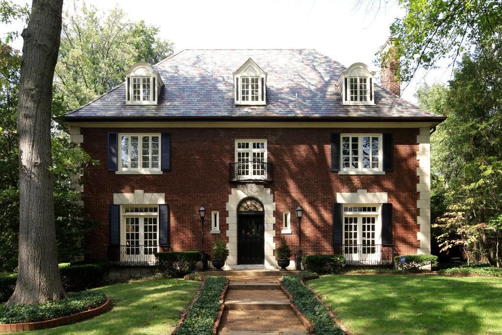 NEW PRICE! Stately 2.5 story traditional home on one of Clayton's most sought after streets - Southmoor.  This gracious home boasts both formal and casual spaces, perfect for entertaining as well as day to day living.  The floor plan features a vestibule and entry foyer with a dramatic view of the dining room through a wall of leaded glass windows and French doors, formal living room with a fireplace, library/den, spacious family room off the kitchen, half bath, and two back staircases complete the main level. The second level includes a landing used as a game room, a master bedroom suite and sitting room, and 3 additional bedrooms and 2 additional full baths. One of the bedrooms is currently used as a second floor family room. The third floor offers 2 more bedrooms and another full bath. One of these bedrooms is currently used as an office. Enjoy the large backyard, pool and screened porch. Convenient location close to highways, Wash U, beautiful Oak Knoll Park.