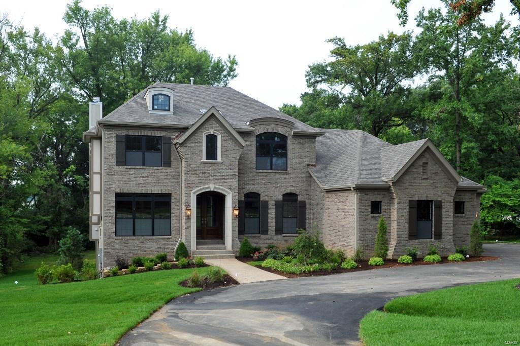 Impressive NEW home in the Village of Westwood with lovely design and upscale finishes, has great street presence with a gracious circular drive on a beautiful .844 acre lot. An open floor plan with 4,000 sq ft of space is perfect for todays living.  Main floor  entry opens to a living/study and dining room on each side and continues to a spectacular great room with 11 ft ceiling and black granite surround fireplace.  The hearth room with stone fireplace opens to the breakfast room and smashing creamy kitchen w/ stainless appliances.  Hardwood floors and an abundance of windows are throughout. A terrace overlooking the tree lined backyard is off the hearth room. Master suite is on the main floor w/ 3 additional bedrooms and 2 baths upstairs.  An oversized loft space completes the upstairs and is great for a playroom/media room or office. Amazing location next to medical centers, shopping, highways, restaurants and so much more!!