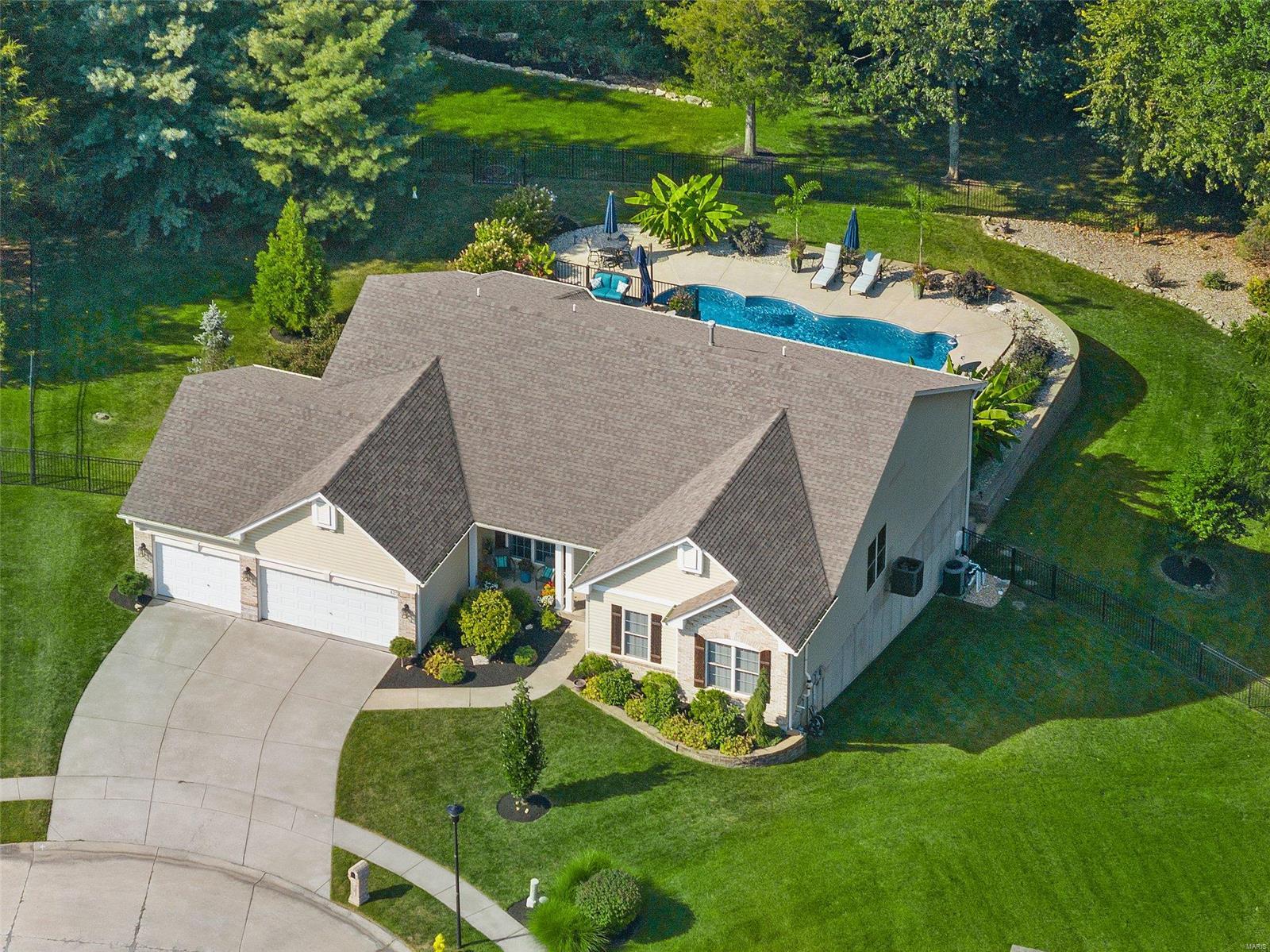 WOW! Experience luxury living in this exceptional home-nestled on a quite cul-de-sac in the highly sought-after Boulder Ridge subdivision! This stunning upscale residence combines sophistication & practicality w/ an expansive open concept design, soaring vaulted ceilings, & gleaming hardwoods. Every detail has been meticulously & thoughtfully upgraded, from luxurious finishes to the spa-like primary bathroom w/ soaking tub & custom rain shower, primary bedroom dual walk in closets, & gorgeous kitchen w/ modern fixtures, sleek tile backsplash, quartz counters, & custom cabinetry-perfect for showcasing your next culinary masterpiece. The finished basement offers endless possibilities—game room, home theater, or guest suite. Enjoy effortless entertainment in your private backyard oasis, featuring a sparkling pool & soothing hot tub. With a spacious 3-car garage & ample storage options, this home meets every practical need while exuding elegance for a truly remarkable living experience.