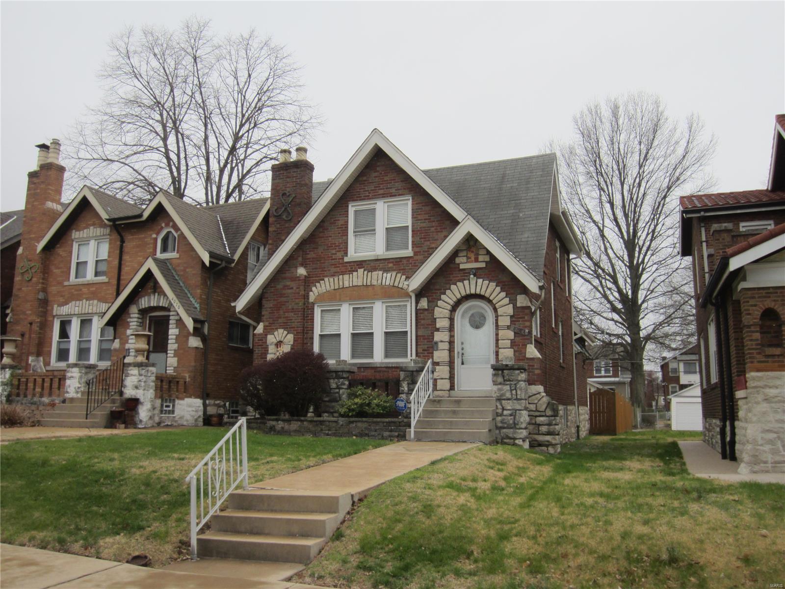 Opportunity knocks! Heart of Holly Hills. Brick and stone 3 BDR, 2 BATH charmer on divided parkway boulevard just steps from historic Corondolet park. Enter your spacious living room with refinished oak floors, stain glass, and gorgeous millwork.  Enjoy full dining room, great for family dinners. You'll love the updated kitchen with 42" custom cabinets, range, microwave, plus central island. Opens to vaulted porch, level fenced yard, ang garage with opener. Full tile bath on main and on 2nd floor. Lots of character throughout with stain glass, walk-in closets, and finished lower level with office, family room, and washer and dryer. This is your chance to own a home on desirable Holly Hills Boulevard. Additional Rooms: Sun Room