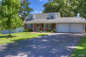 This must be the best value out there!  Beautifully updated 1.5 story with situated on a half acre lot, plenty of yard to run, play, entertain, and a huge in-ground pool!  The great room features an electric fireplace situated between built-in shelving and a stone surround.  The kitchen was just updated last year with new cabinets, top, glass tile backsplash and additional cabinets added for more pantry storage.  Down the hall is the large master bedroom with walk-in closet.  Upstairs has 2 large bedrooms, a fantastic bath with slate tile flooring and shower.  More room awaits for you in the finished lower level wired for surround sound and set up for a projector, large entertaining area perfect for a pool table or darts, and a great built-in playhouse!.  The large deck overlooks a spectacular backyard surrounded by trees overlooking your in-ground pool plus a sitting area next to the pool perfect for a picnic.  Newer roof, ac, windows, and so much more....check this out today!!