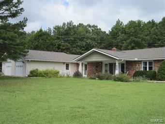 Secluded retreat only 5 miles from Salem, sits this spacious 2,130 sq. ft. home. Energy-efficient, well-maintained, earth berm home with second dwelling for in-laws quarters. Kitchen w/ custom pull-out shelves, lots of cabinets & counter space. Large master BR suite w/ walk-in closet. Second bath features a jetted tub. Main level home w/ no stairs or raised door thresholds, & accessible door handles. Double paned glass windows & doors. Crown molding throughout, custom arch between dining & living areas & ceramic tile floor in foyer. Custom blinds in living room for lots of privacy. 850 sq. ft., 2 car attached garage w/ attic space offers additional storage. New 2015, 30-year roof. Chicken coop, garden, fruit trees, small wildlife pond & abundant wildlife. 2 storage sheds, 1 with electric & A/C for storage or a shop. Perennial landscaping w/ native Missouri plants is low maintenance and requires virtually NO watering! Move in ready home in the country, priced to sell quick. Some Accessible Features