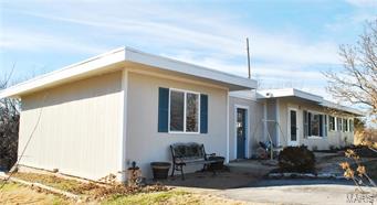 NO SHOW UNTIL 2/26/16!  Move in ready ranch!  You will love this bright open floorplan the second you step foot inside,  You'll be greeted with fresh, neutral paint and warm tone wood flooring.  The family room is accented by large front windows that bring in tons of natural light.  The spacious eat-in kitchen features a tile backsplash, wood cabinets, tile flooring and access to a wooded backyard via patio doors.  3 bedrooms located on the north end of the home will ensure that you have plenty of room for family and friends.  Wait until you see the master bedroom!  Converted from the original location of the garage, you'll have tons of room for even the largest of bedroom furniture!  Other benefits include updates throughout, huge lot 1.5+/- lot, quiet street and terrific location to HWY 30 and 141!