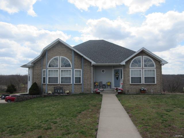 A must see with TON'S of space and located just minutes from all the major dining and shopping the St. Robert area!  This home offers 4 bedrooms, 3 full bathroom, a great room, family room, formal living room and a 2 car garage wit openers!  If you like spending your time in the kitchen, you will LOVE cooking and entertaining with all the counter space, custom cabinets, ceramic tile floor and a beautiful breakfast bar area!  All the detail this home offers with built in wall units, tall base trim, arched entryways in the kitchen and bathrooms and all the beautiful custom tile work through-out the home!  The property also offers beautiful landscaping & curb appeal, a new heatpump unit installed within the last two years and all the kitchen applicances have recently been upgraded to stainless steel Samsung models, to inlcude, a side by side refrigerator with bottom freezer drawers, electric oven/stove top, dishwasher and built in microwave.  All great reasons to view this home today!!