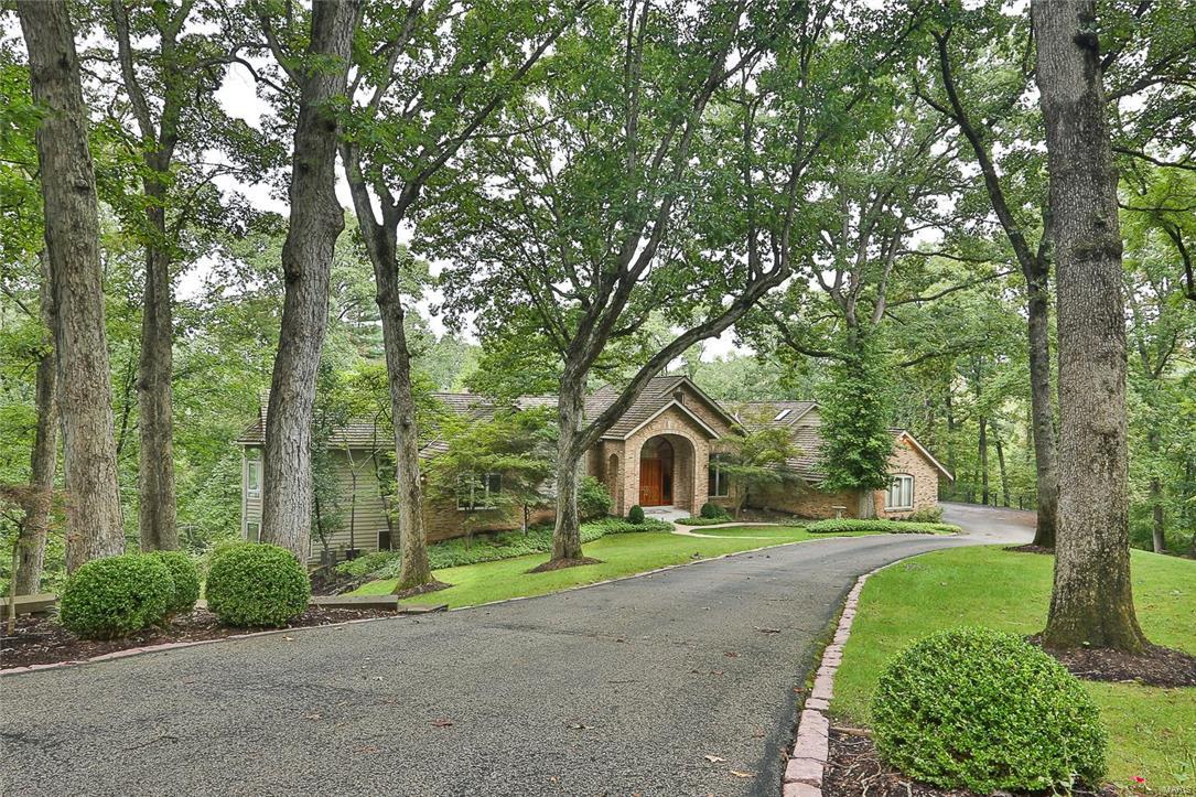 Astounding & Beautifully built Custom 5 Bedroom, 5.5 Bath, Ranch style home situated on a gorgeous 3 acre lot with private heated in ground Pool surrounded by dual brick paver Patios.  Brick accent exterior with an amazing front Porch & beautiful wood French entry  doors welcome you inside to a very distinctive 2 Story Entry Foyer & the start of a phenomenal open floor plan.  This sensational home features include 4 fireplaces, crown, vaulted & 10' ceilings, 2 wet bars, surround sound system, French & Atrium doors, Bay windows, 2 spiral stairways, marble & wood floors, zoned HVAC, heated dual 4 car Garage, 50 year old shake roof & more.  Great room, Den, Dining room & Kitchen all flow together.  Amazing Kitchen with granite, custom 42" cabinets, stainless steel appliances, triple sink...  Master Bedroom Ensuite with fireplace, walkout & spa Bath including a Sauna & a wet bar.  Upper level Loft with wet bar, sleeping area & full Bath.  Lower level with Family/Rec room, walkout & more.