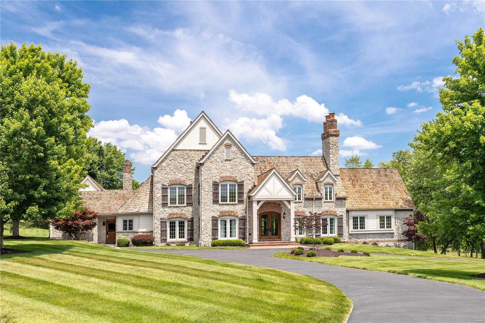 Rare opportunity to own this iconic St Albans home! Located on an oversized level lot w/ a beautiful view of the 17th green & fairway. Offering a private feel, yet close to club amenities. This stunning gem features top-of-the-line finishes throughout! Enter through the custom front doors to find the spectacular, soaring great rm w/ a stone fireplace & a walk-behind wet bar. Continue all the way through to the beautiful grand hall of French doors leading to the rear patio, featuring multiple sitting/dining areas & separate fire pit. The gourmet kitchen features high-end appliances, double ovens, 6 burner gas cooktop, granite countertops, oversized island & adjoining breakfast & hearth rms. The ML primary suite features private access to the patio & a luxury full bath. 3 addtl bedrms & 2 full baths on the UL. The beautifully finished w/o LL offers a rec rm, exercise rm, bar area, custom wine cellar, game rm, billard rm & half bath. Truly exceptional w/ custom amenities at every turn! Additional Rooms: Mud Room