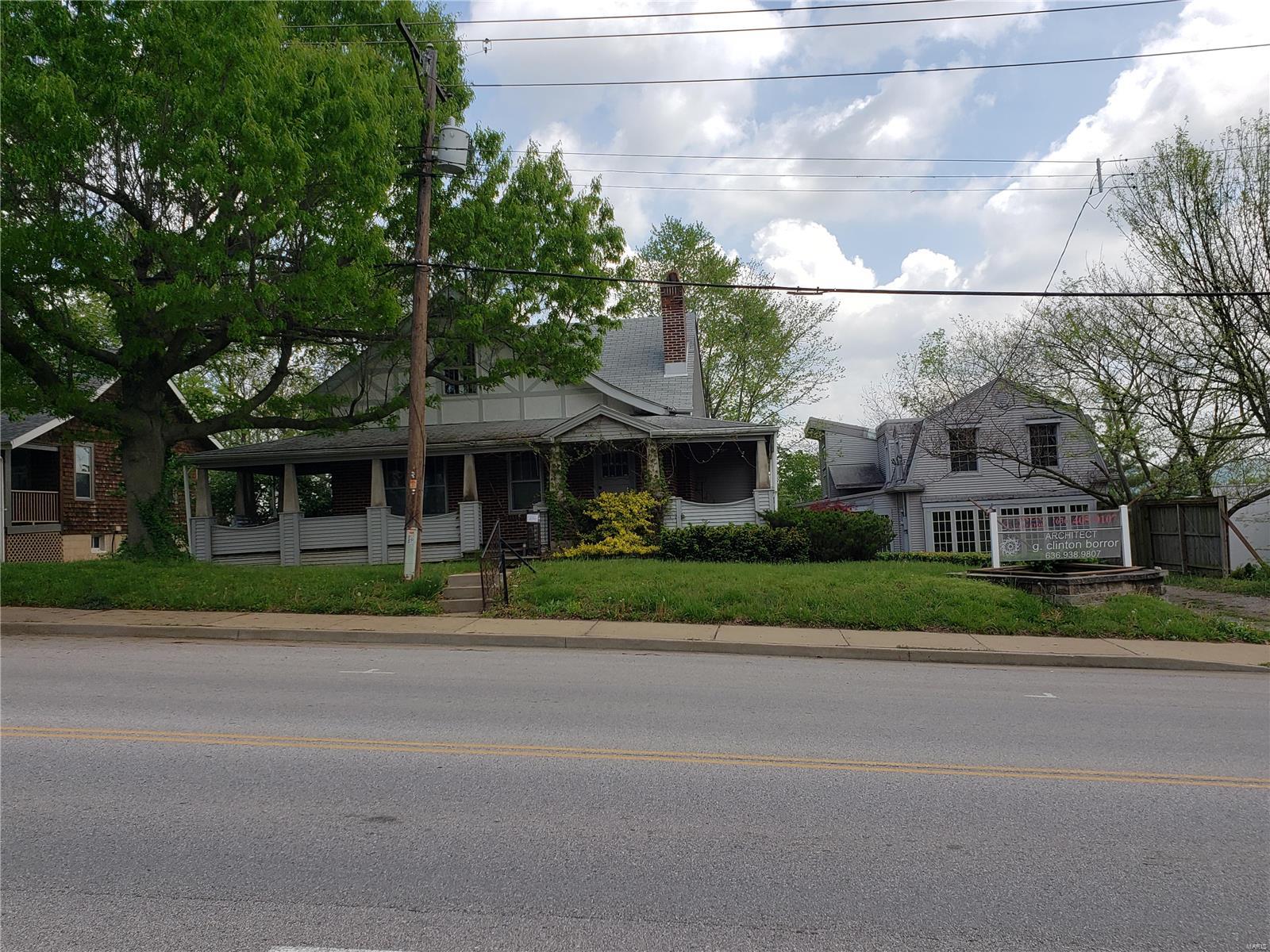 Unique Business Opportunity! Prime Commercial Property in Olde Towne Eureka! Two buildings on one parcel and so much character. Rental space galore.  Both buildings are zoned commercial AND residential. Selling as is, please use a Special Sale Contract. Inspections are encouraged for the buyer's information only.  This is a home with an architectural business next door.  The home boasts a wrap-around porch, screened-in porch, 3 beds/2baths, and a large family room with high sloped ceilings. Original stained glass windows, woodwork, and hardwood add to the quaintness. Large atrium-style great rooms in both buildings for natural light. This home has 1000+ square feet of finished basement. Walkout with a fenced yard. More parking off the alley.  Home warranty included. Inspections and improvements are included in the supplements.  Not in the flood plain. This quaint town is the perfect spot to make dreams come true. Perfect for an air BnB, holiday store, florist, and so much more.