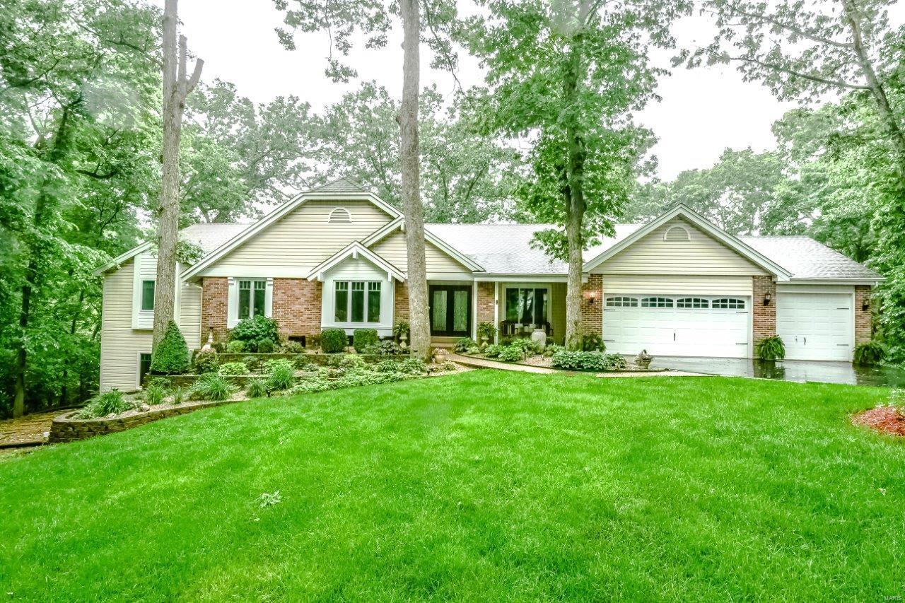 Nature Lover's Paradise! Atrium Ranch on 3 Wooded Acres on Peruque Creek with Full Lake St. Louis Amenities. Fabulous gourmet kitchen with top-of-the-line Jenn-Air appliances with oversize built-in refrigerator, built-in ovens and microwave, beverage cooler and wine cooler, tons of granite counters & huge center island breakfast bar with vegetable sink, pasta water over custom stove. This kitchen is sure to please every savvy buyer. New LVP flooring throughout main floor living area. Vaulted great room with atrium overlooks the private wooded lot & waterway to Lake St. Louis. The sprawling first floor has a large foyer, formal dining room with crown molding, great room with fireplace & beautiful craftsman shelves, a separate family room/sun room off kitchen & 4 Bedrooms on the main level. The 22x17 master boasts a sitting area with fireplace and door to one of the two new decks. The Finished W/O LL has a Theater Room, Rec Room, Full Bath & Bedroom 5, plus 2 storage areas & a workshop.