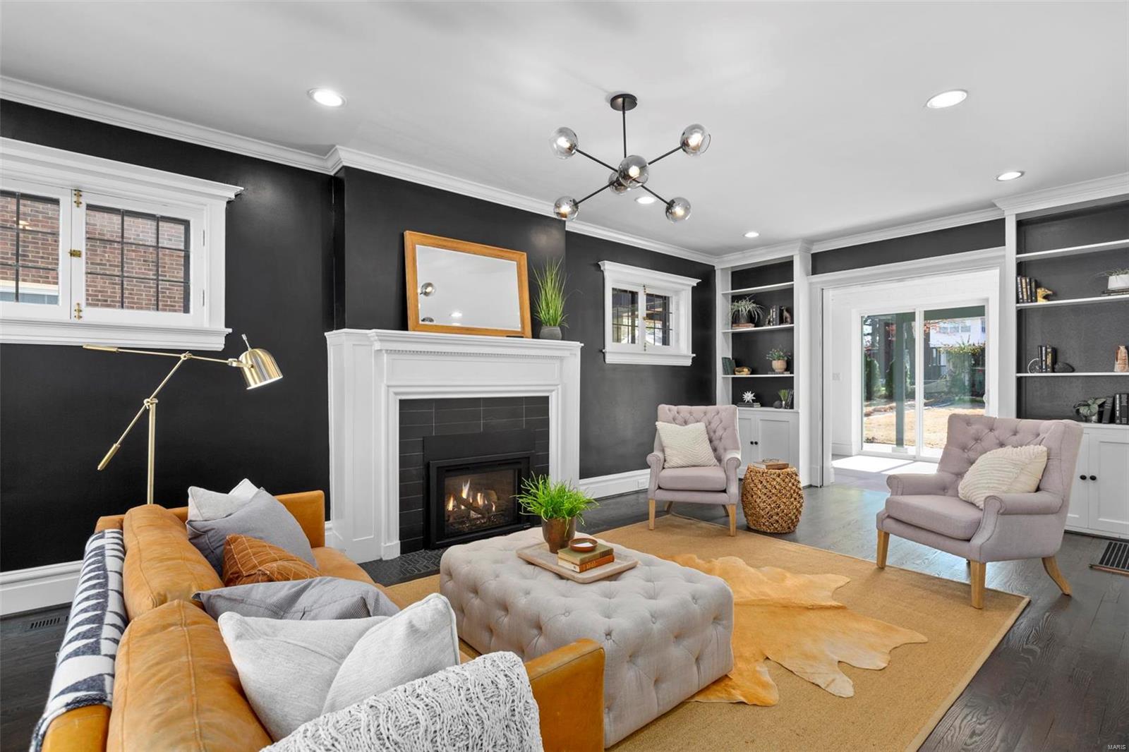 This is the home you’ve been waiting for after a 10-month professional rehab! This Georgian colonial, in coveted Forsyth Place on quiet “Little Lindell” is walking distance to Forest Park, Wash U & Clayton shops/restaurants. Spacious & bright entry foyer welcomes you into either the LR or DR through majestic archways w/ all new hardwood floors. Generous sized LR dressed in elegant details like built-in bookshelves, Forshaw gas fireplace & period millwork. The eat-in Chef’s kitchen is decked out in new Viking appliances & the open floor plan is ready for entertaining. Main level also features beautiful staircase leading to 2nd & 3rd levels which feature not 1 but 2 Master Suites w/ completely renovated baths & floating vanities! 2 additional generous sized rms on 2nd level have been refinished w/built-in storage closets, added study spaces & 2nd floor washer/dryer. Enjoy the outdoors on a new, open patio w/ two huge sliders & a second covered patio & two-car garage.