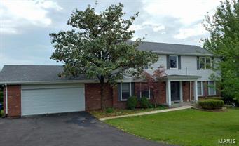 Home offers a gorgeous view of 5 acres of open common ground with a beautiful view of a lake. The backyard is a level lot perfect for a future pool! Located near the end of a cul de sac on almost 1/2 acre lot, large patio & newer deck overlooking the common ground. Newer laminate flooring, great flow for entertaining with large family. Updated eat in kitchen, great counter/work space area for the one who loves to cook. Family room with wood burning fireplace & open to living room & deck. Formal dining room. Upstairs you will find a very spacious master bedroom w/it's adjoining sitting room, 3  closets (2 of which are walk-in closets), and full private master bath. 3 addtl. bedrooms & full bath finish off upper level. Walk Out lower level with rec room, half bath. Newer garage door, Architectural roof in 2007, main floor laundry. Fantastic location to major highways. Parkway Schools. Additional Rooms: Mud Room
