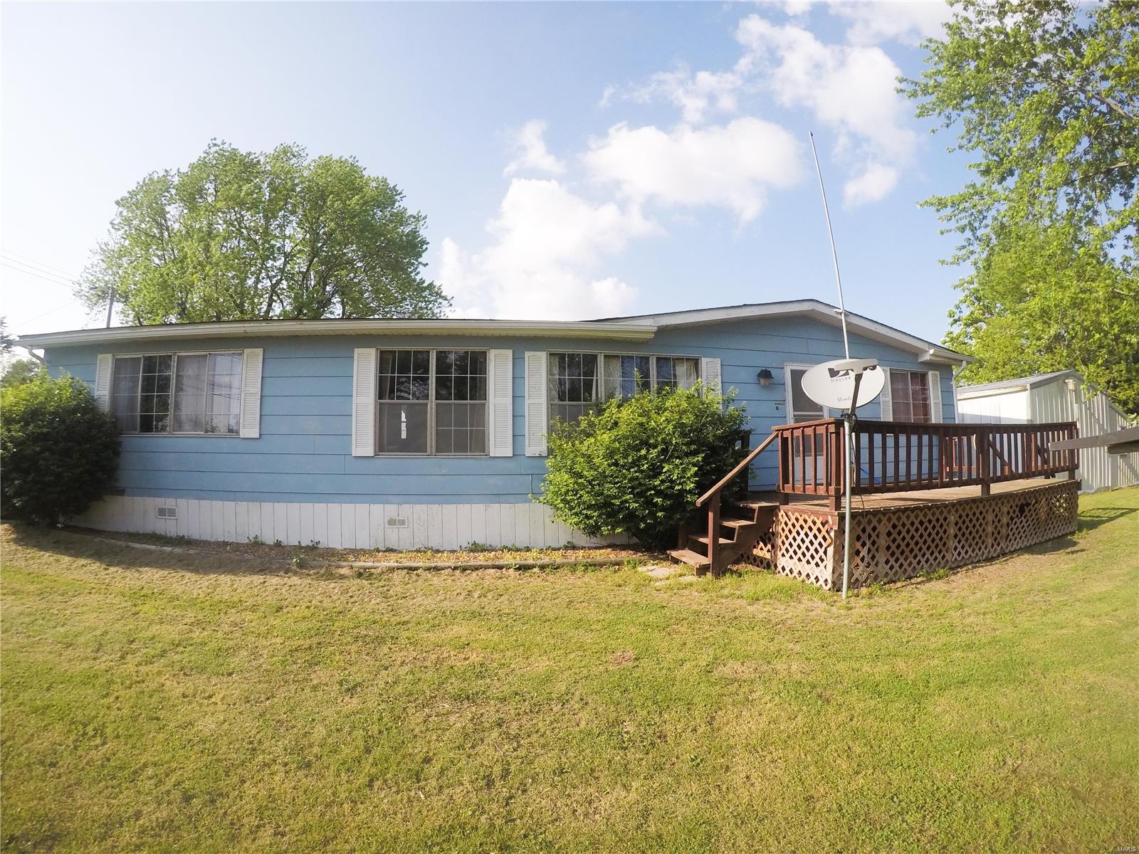 3 bed, 2 full bath manufactured home on a corner lot. All furniture and appliance will convey with sale, including washer/ dryer. Newer carpet in living room, newer flooring in 2 bedrooms, dining, kitchen. Large master bedroom with his/hers closets. Master bath with step-in tub. Close to the school. 26x24 Detached shed for a workshop/storage. All electric. Come take a look!